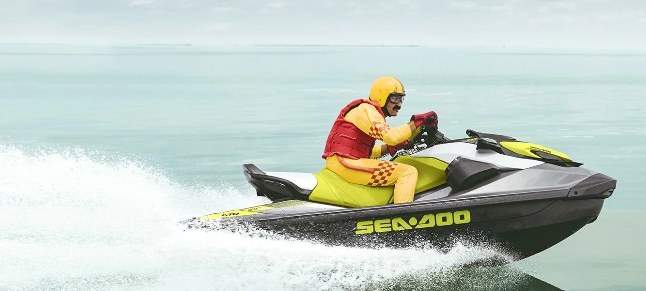 Father and daughter fishing from the 2025 Sea-Doo pontoon boat next to a woman fishing from the 2025 Sea-Doo personal watercraft