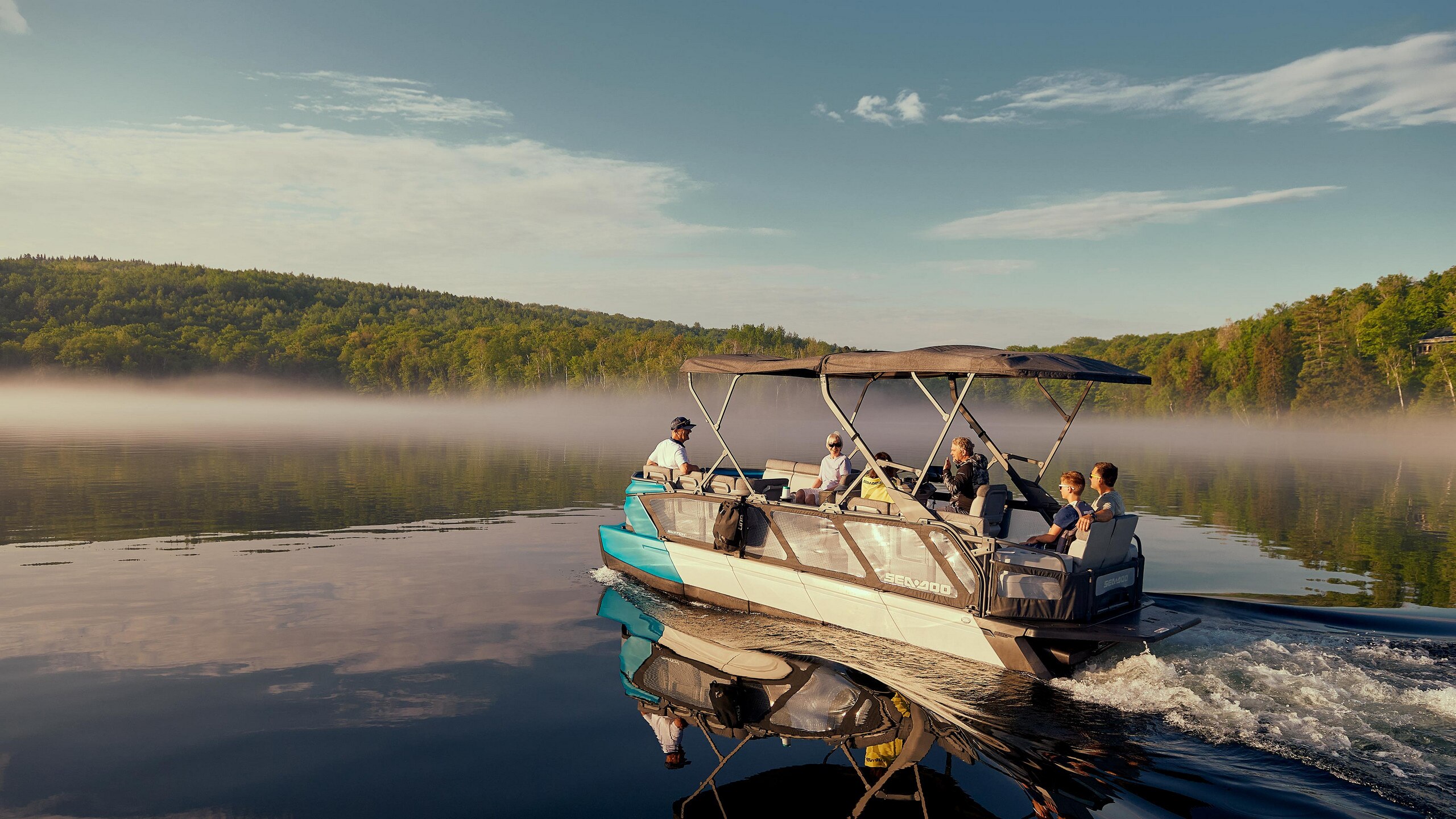 Family cruising on a lake with a Sea-Doo Switch Cruise