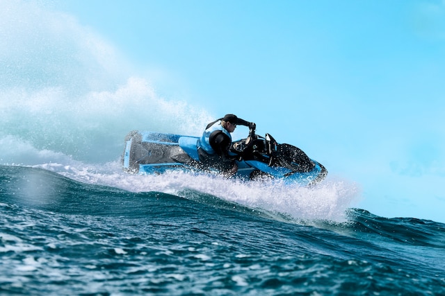 Couple riding a Sea-Doo Spark Trixx personal watercraft