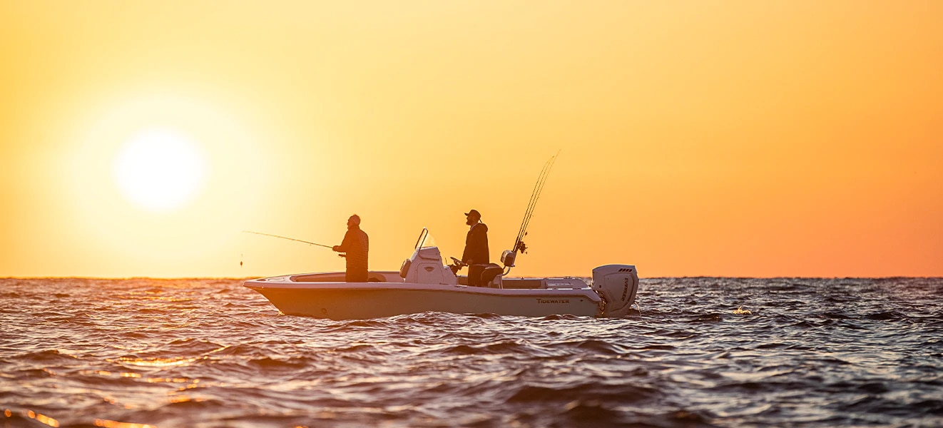 Men fishing on a boat propulsed by Evinrude