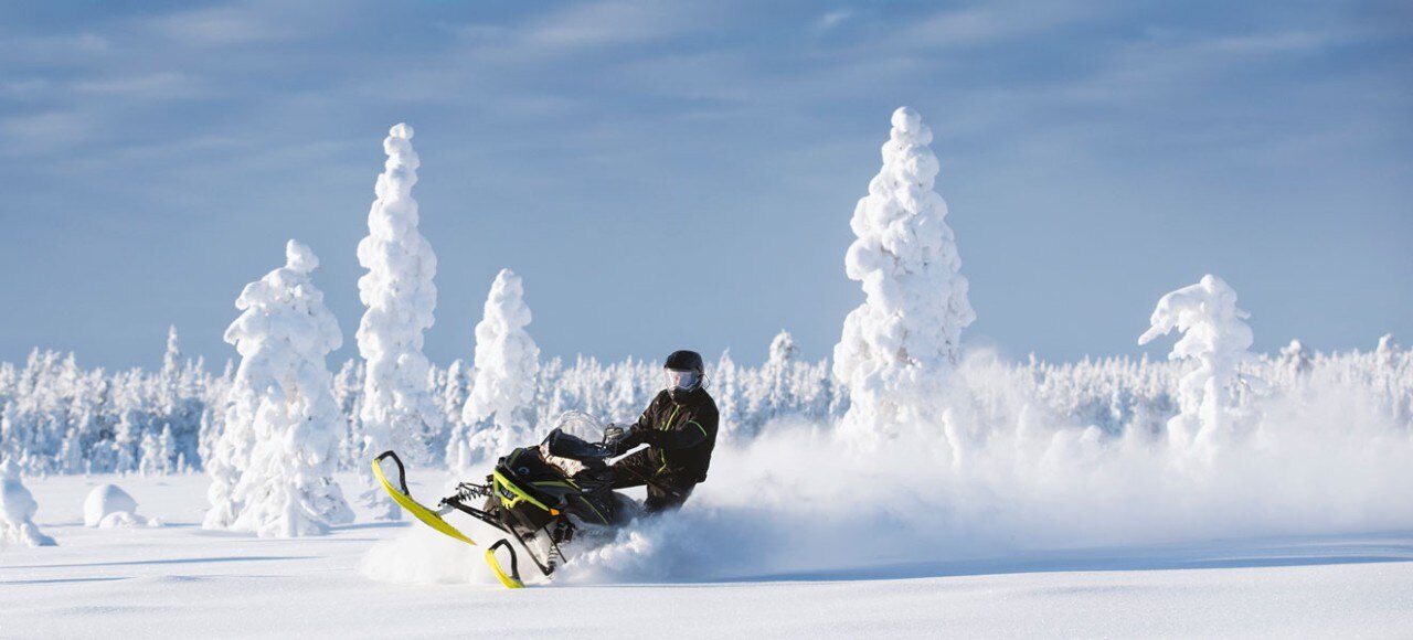 Man riding a Lynx snowmobile