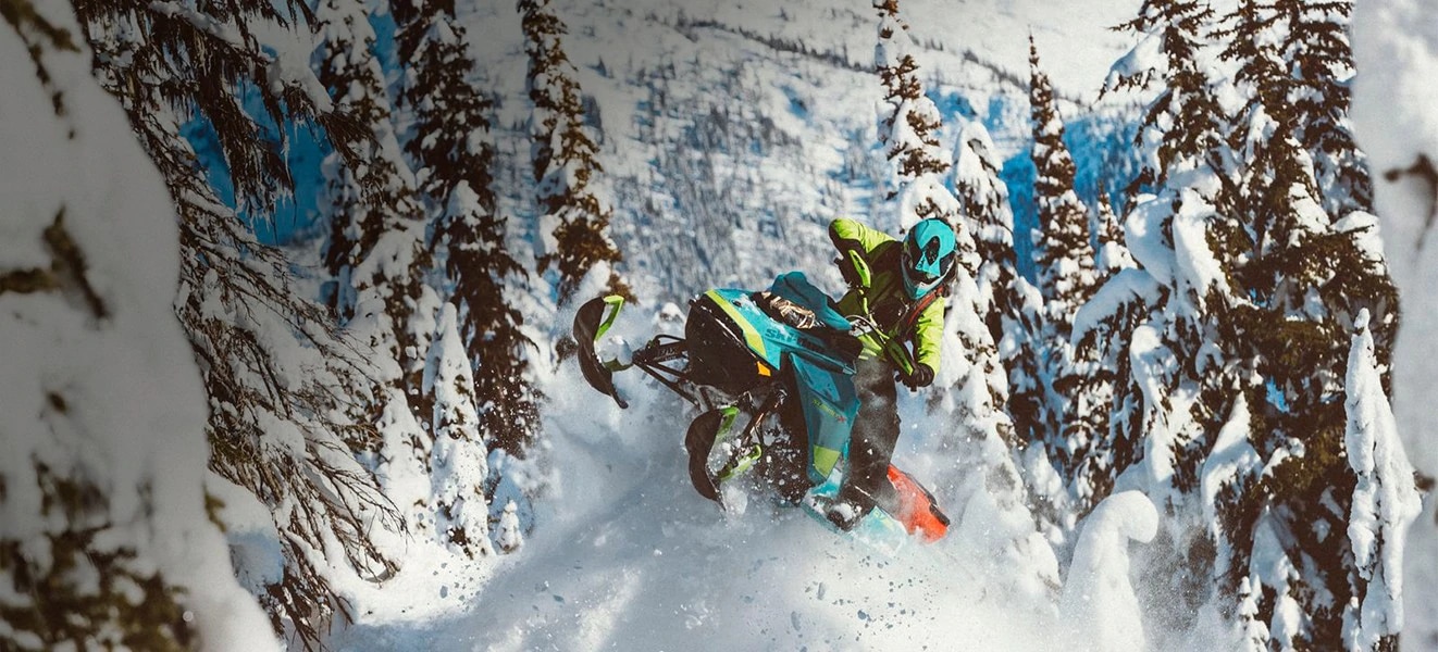 Man riding a Ski-Doo snowmobile