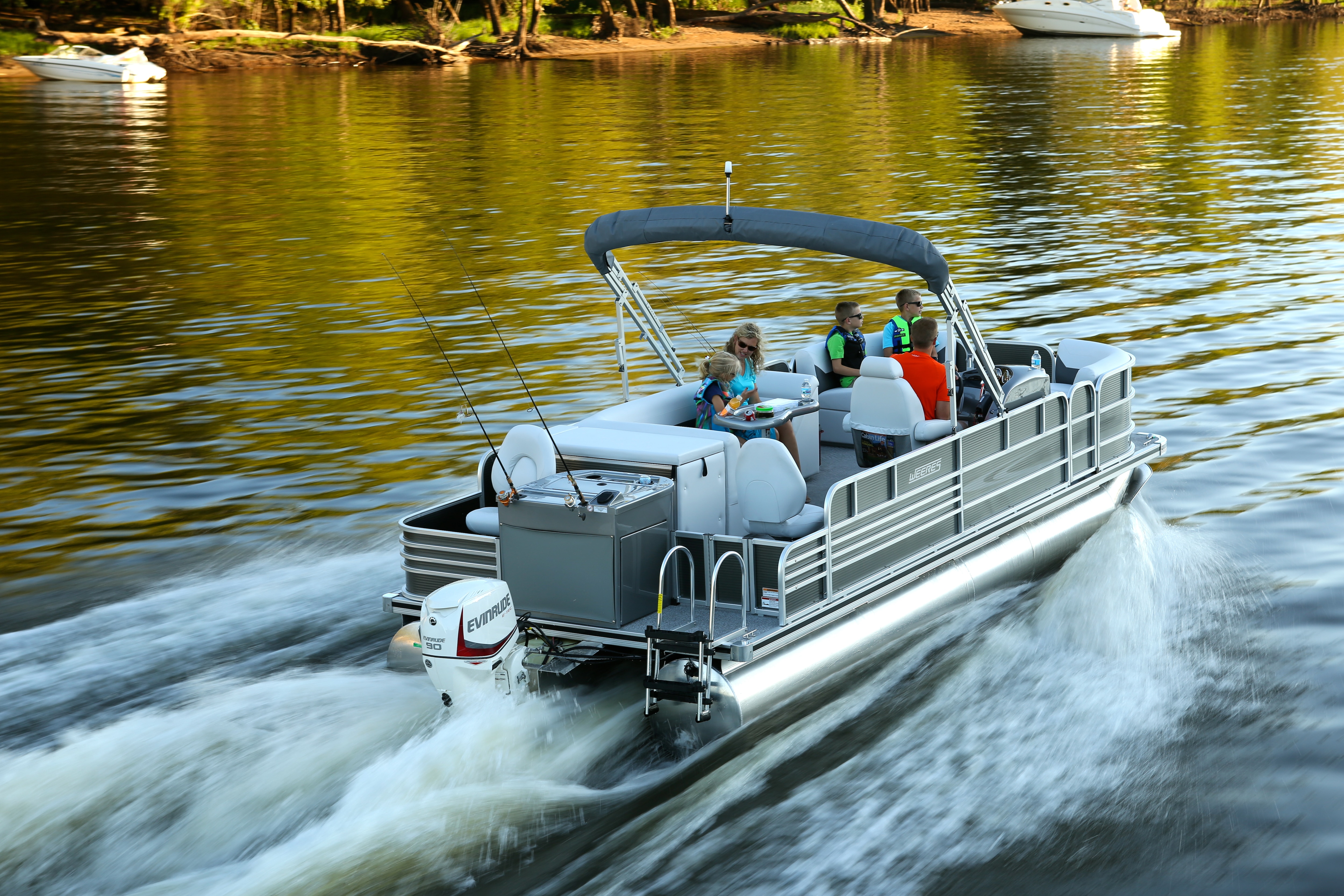 Family driving a pontoon fast