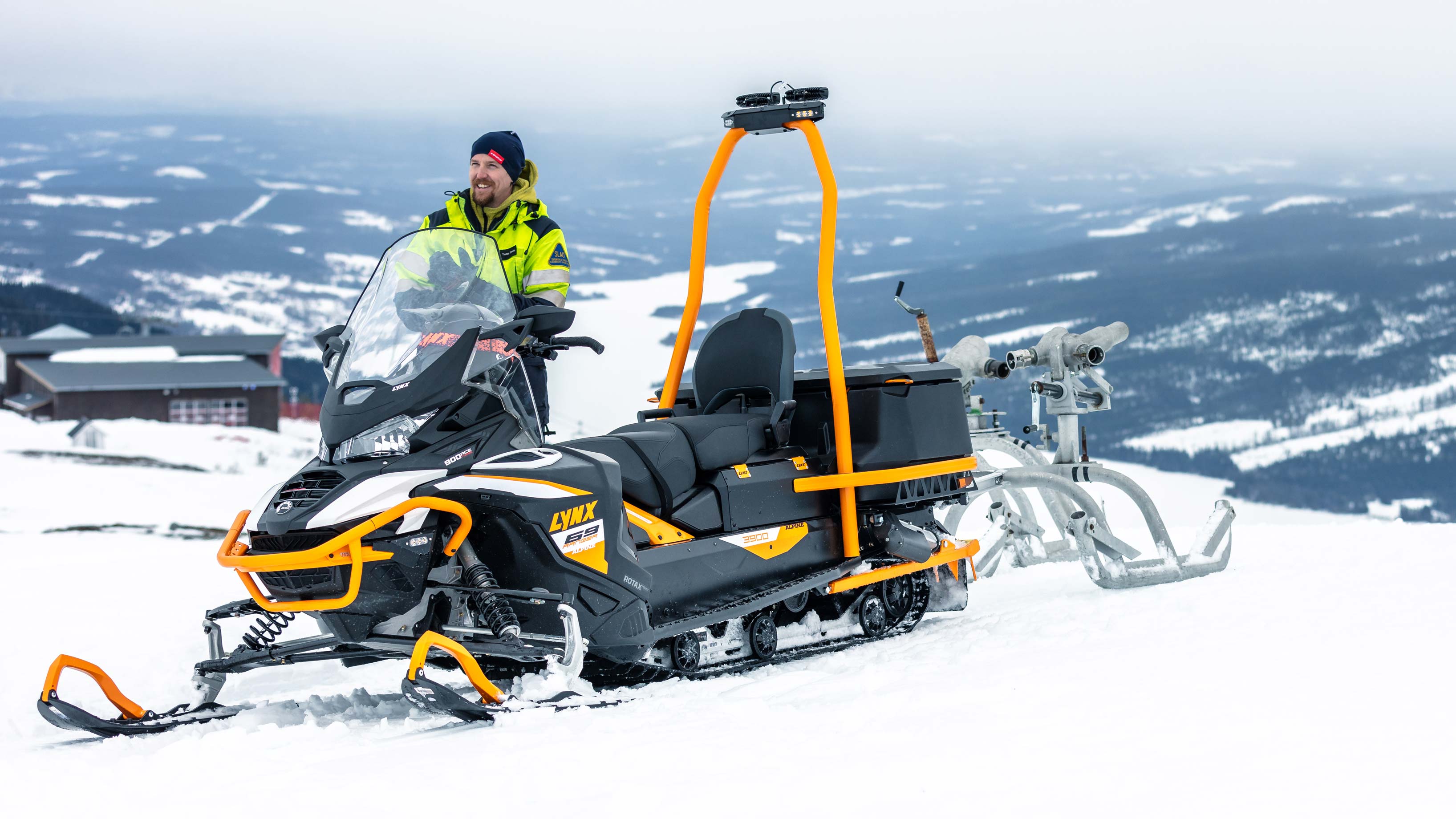 69 Ranger Alpine snowmobile on top of the hill