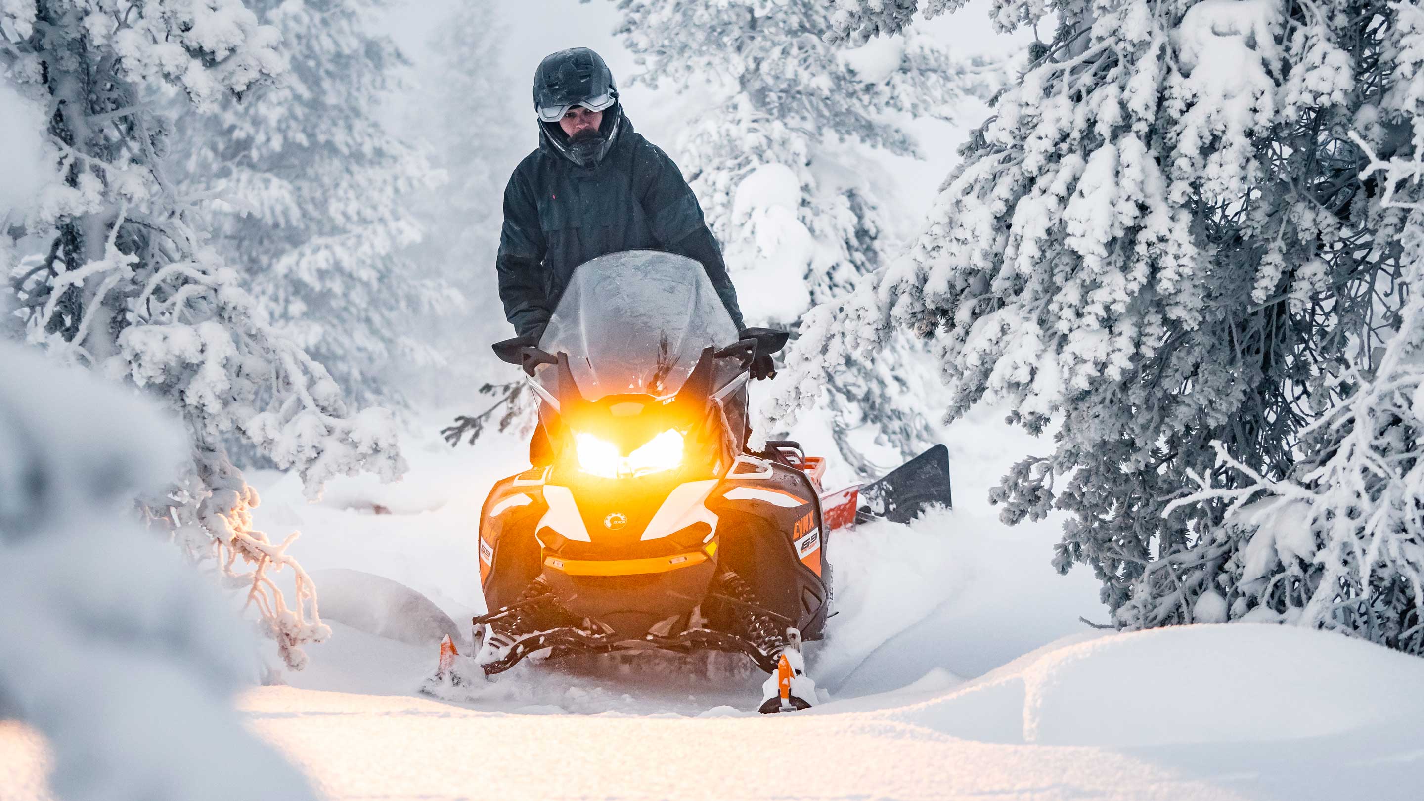 69 Ranger Alpine snowmobile making a trail