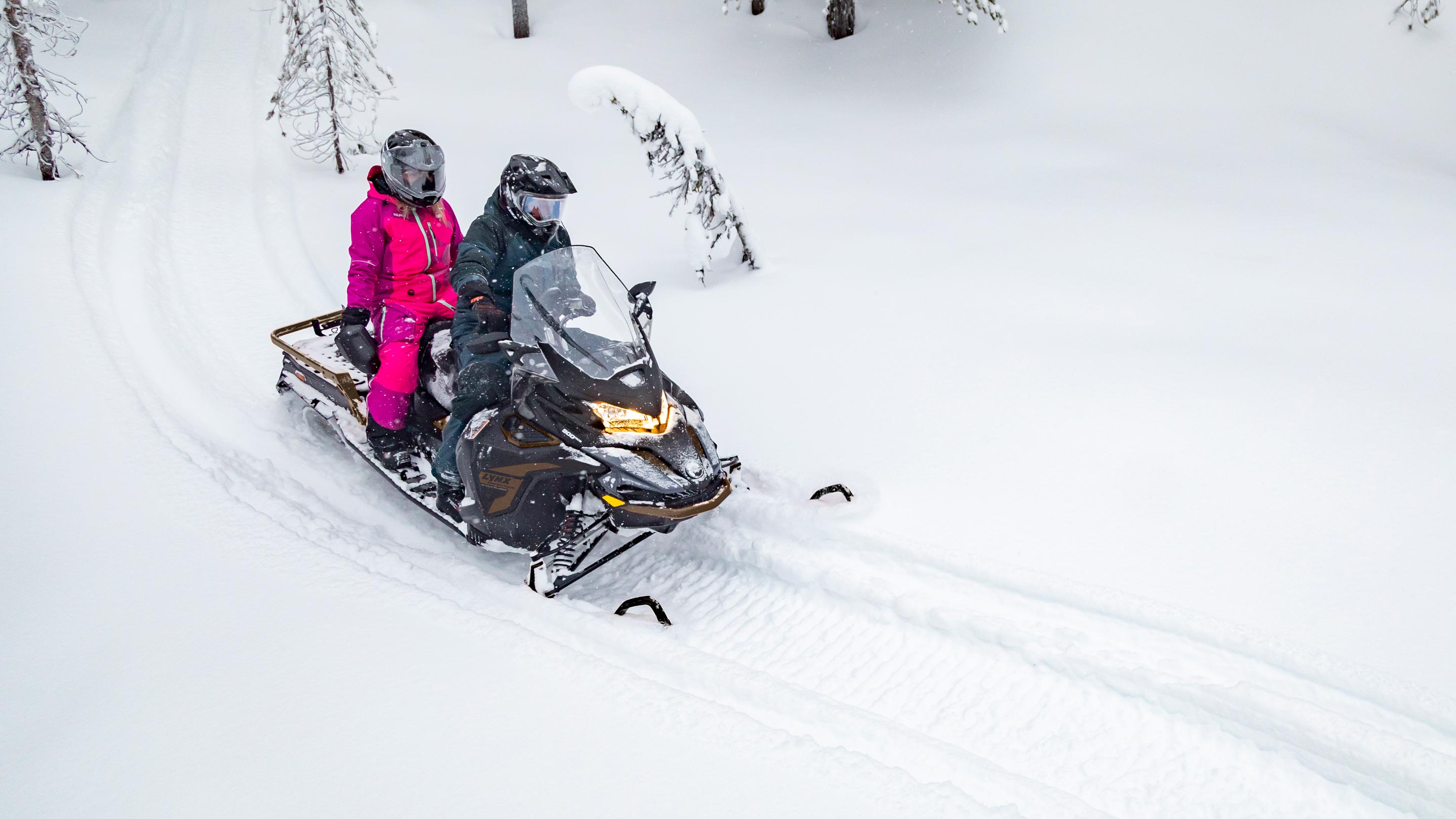 69 Ranger SnowCruiser snowmobile with rider and a passenger