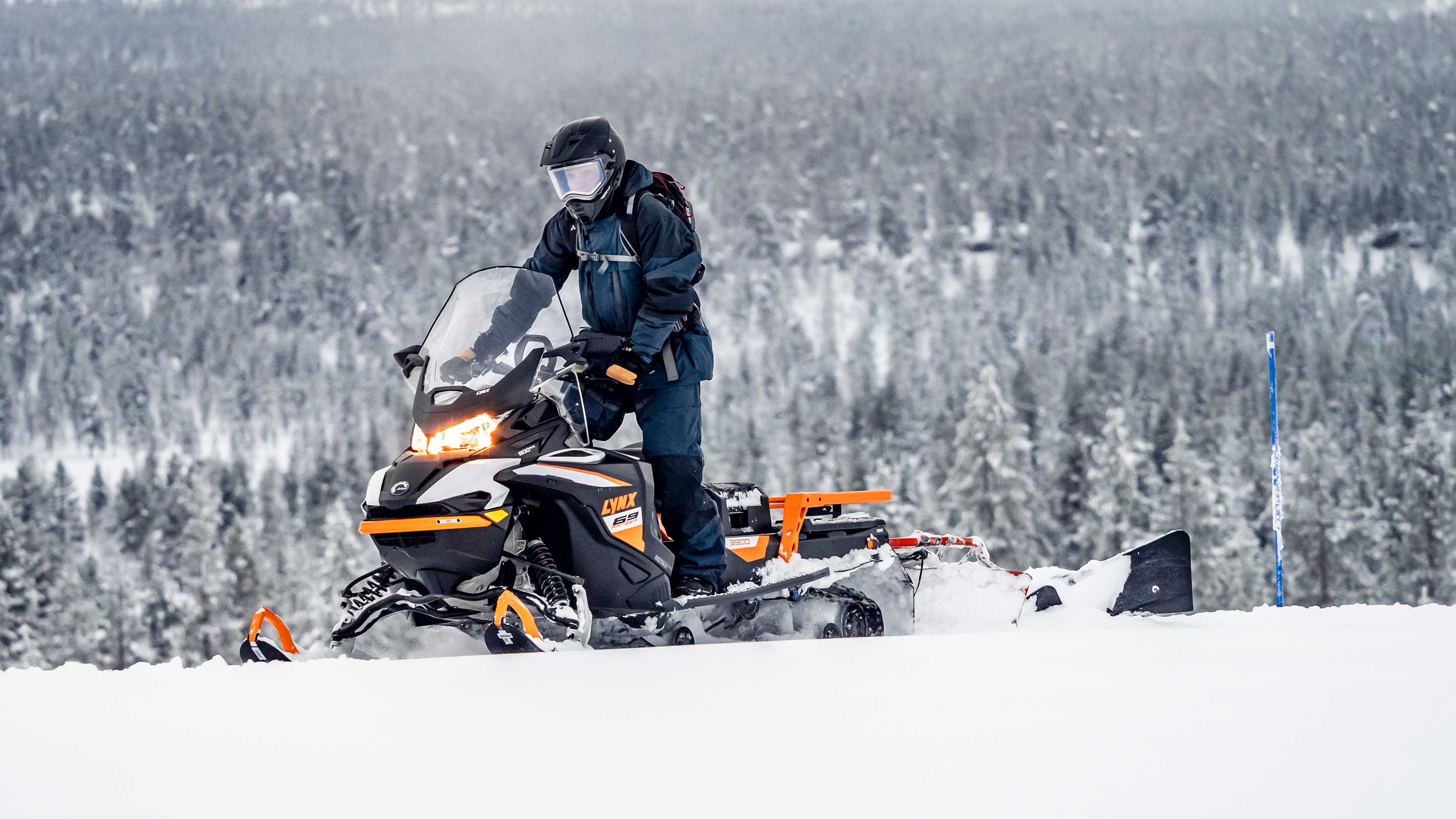 Man riding a Lynx snowmobile