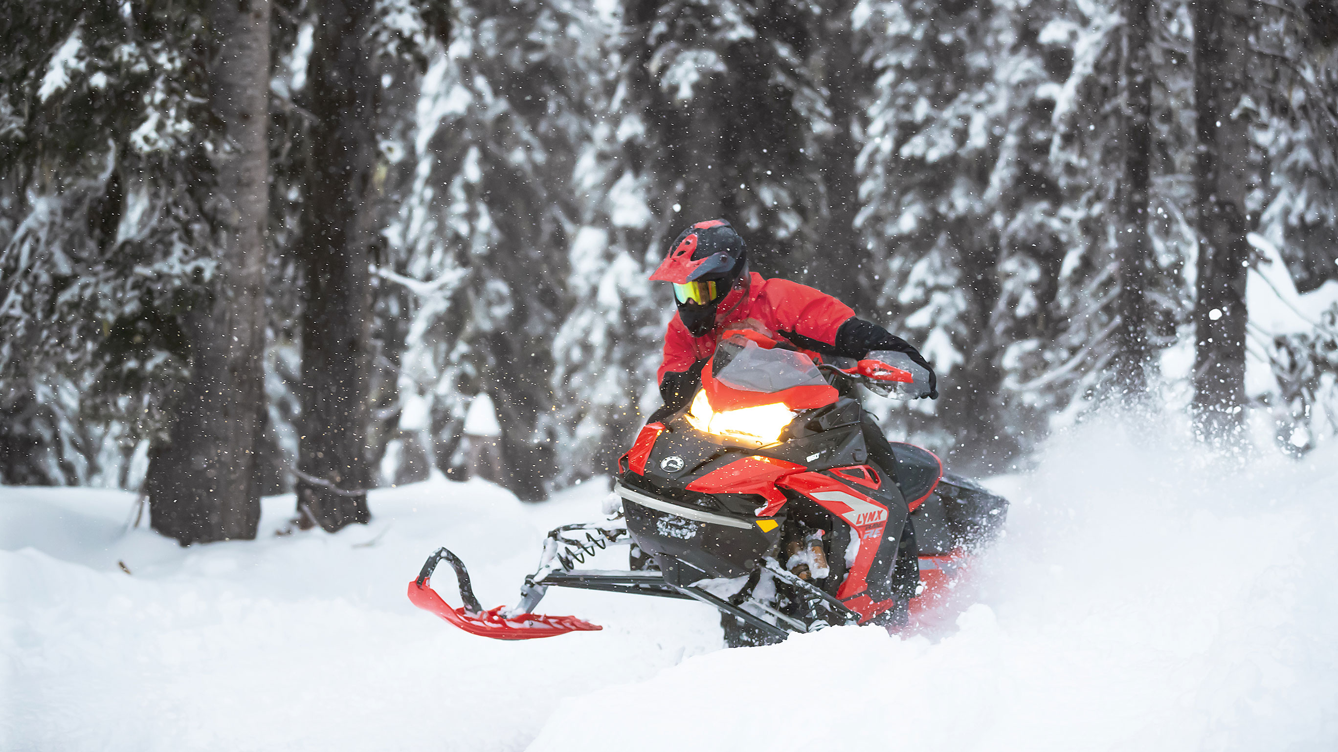 Lynx Rave snowmobile riding on trail