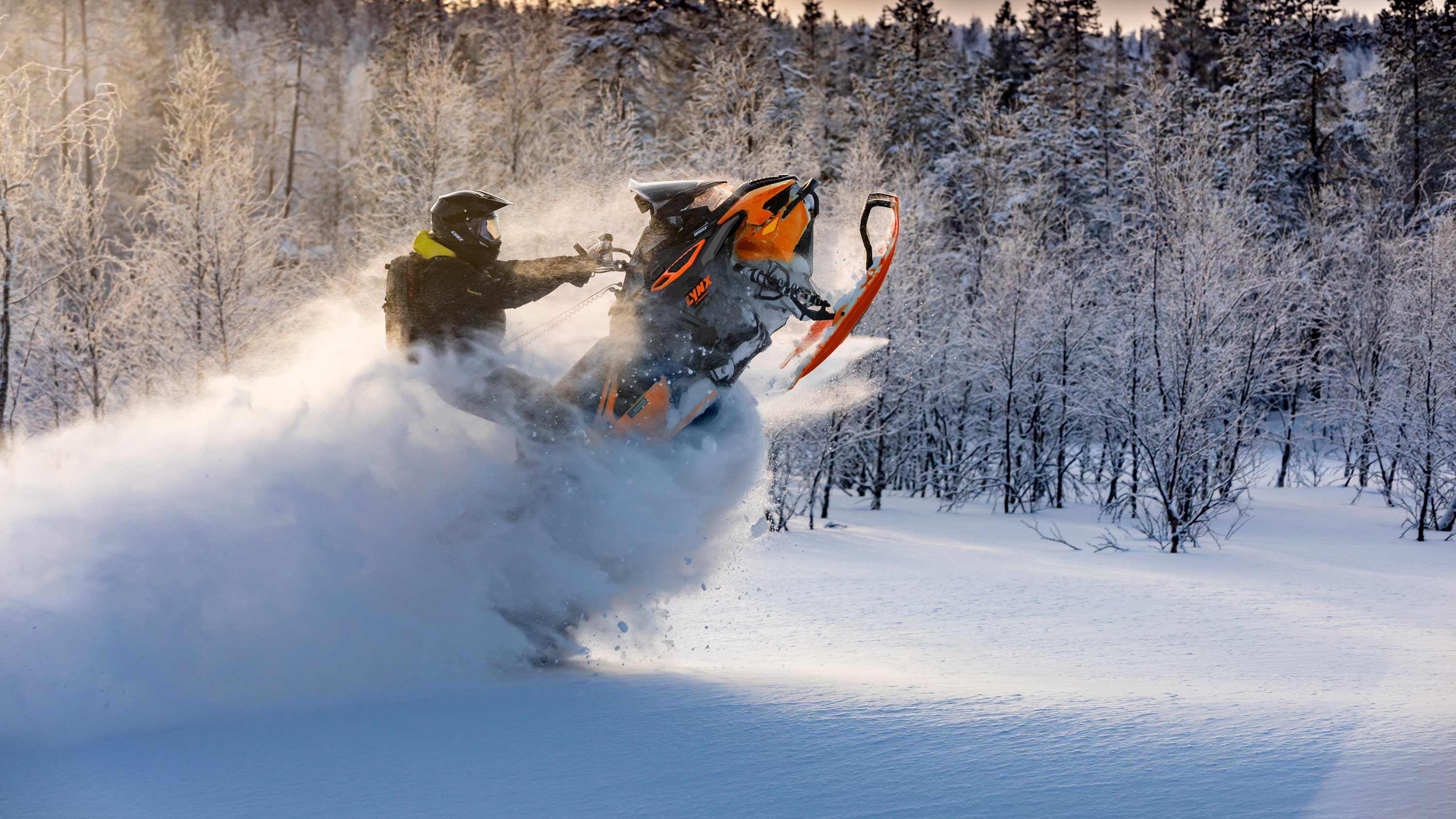 Man riding a Lynx snowmobile