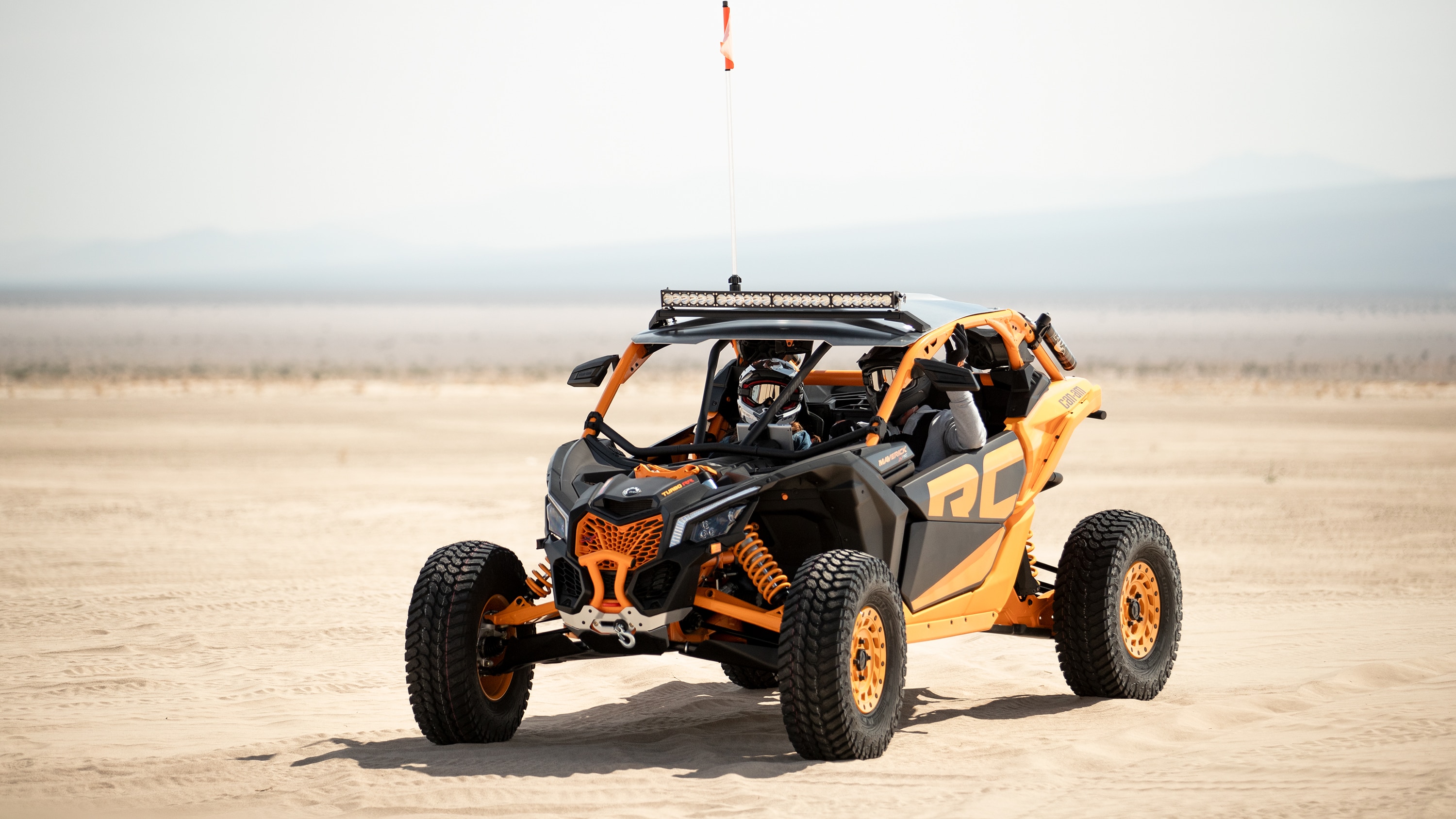 Two men in a Maverick X RC in the desert