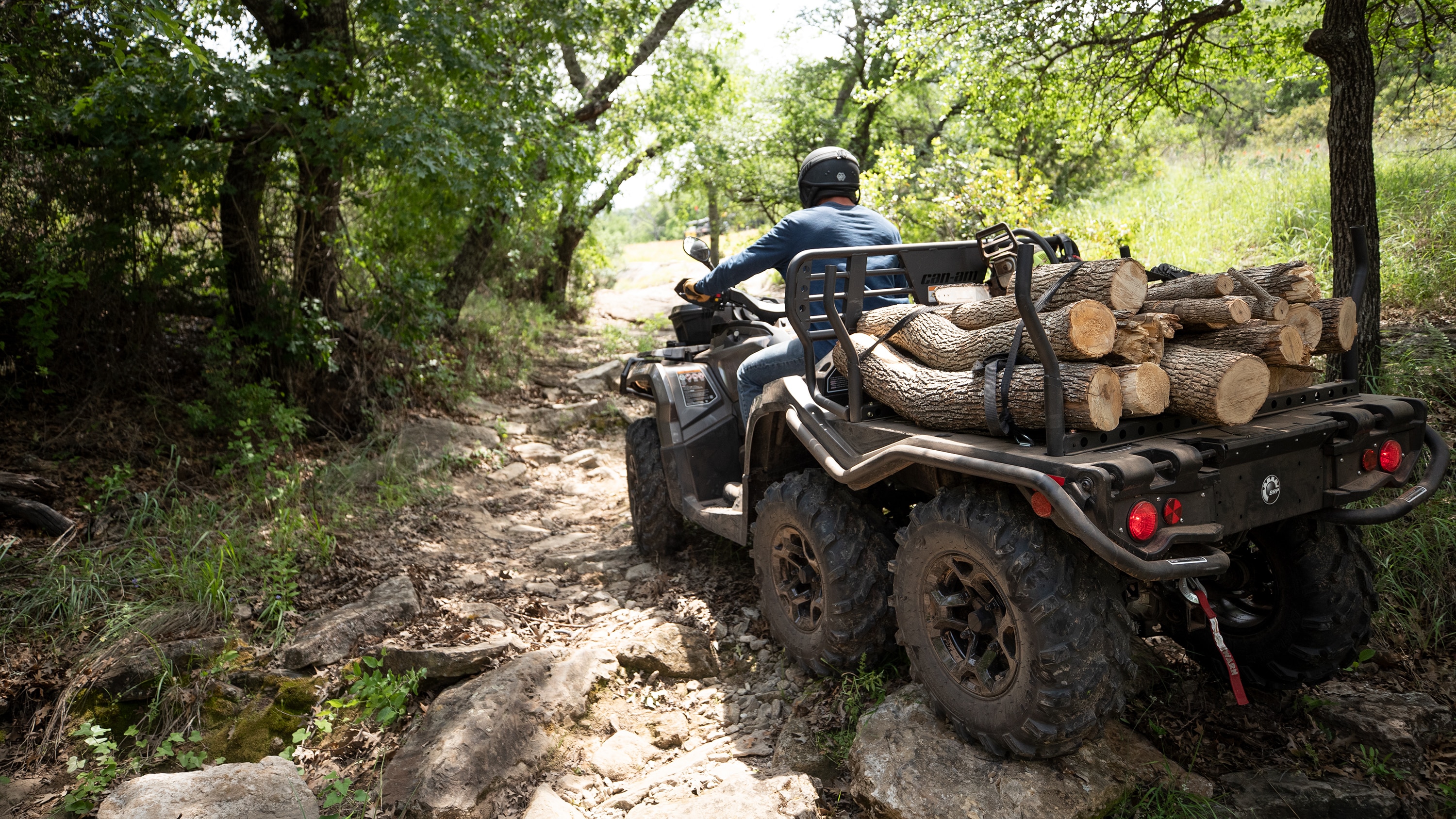 Man carrying wood on an Outlander Max 