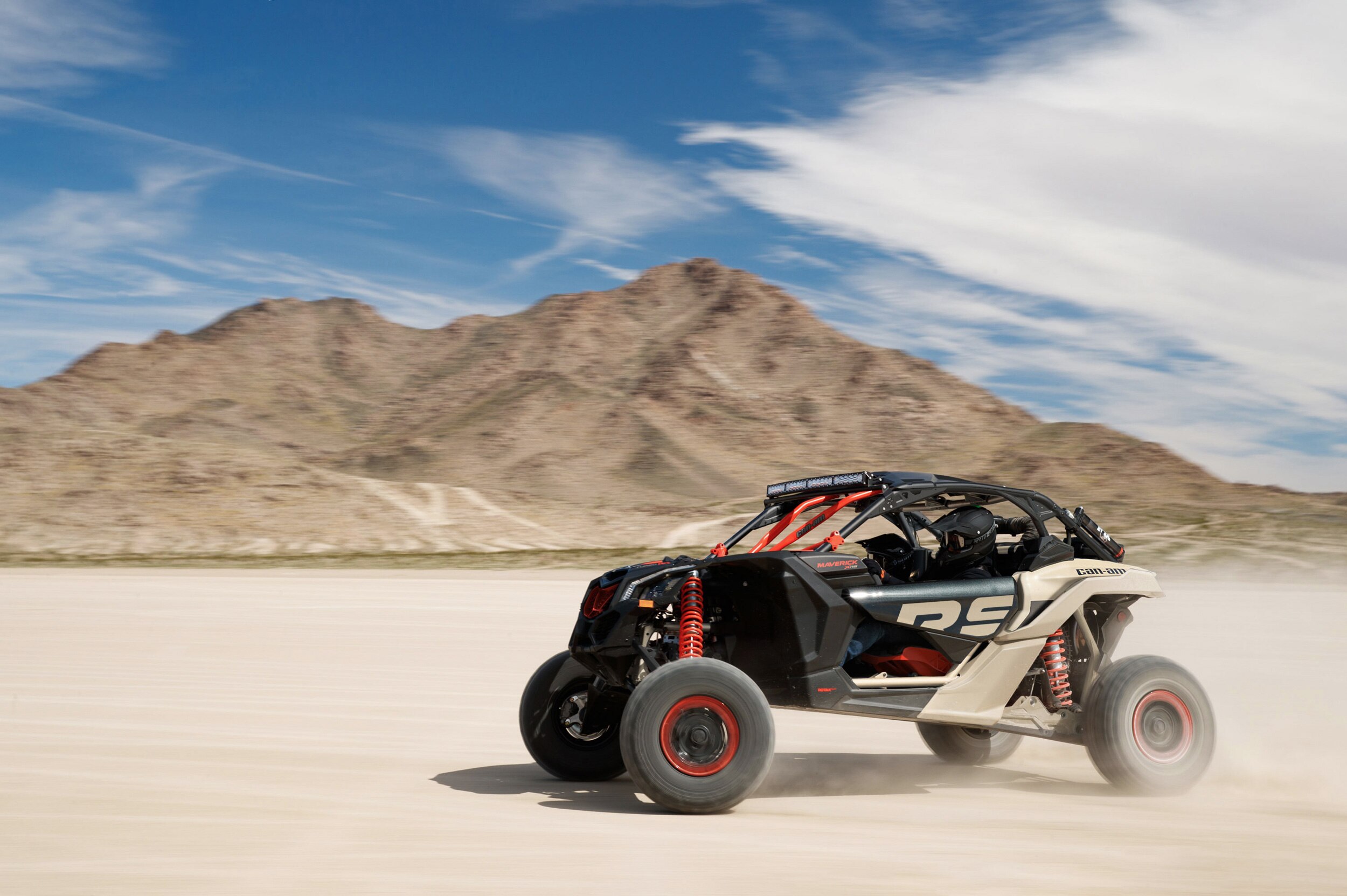 Man driving a Maverick X RS on the sand