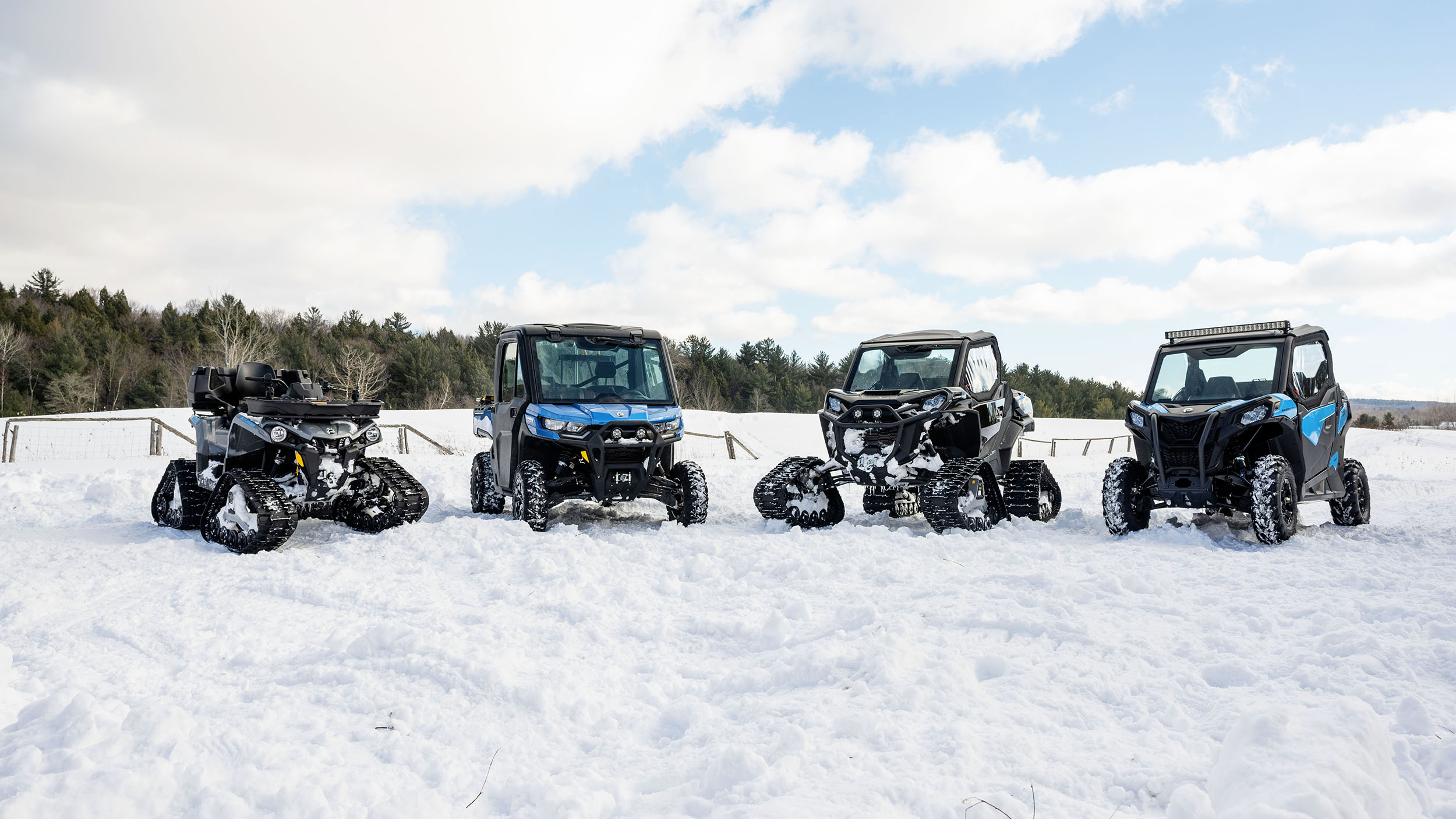 Four Can-Am vehicles sitting idle