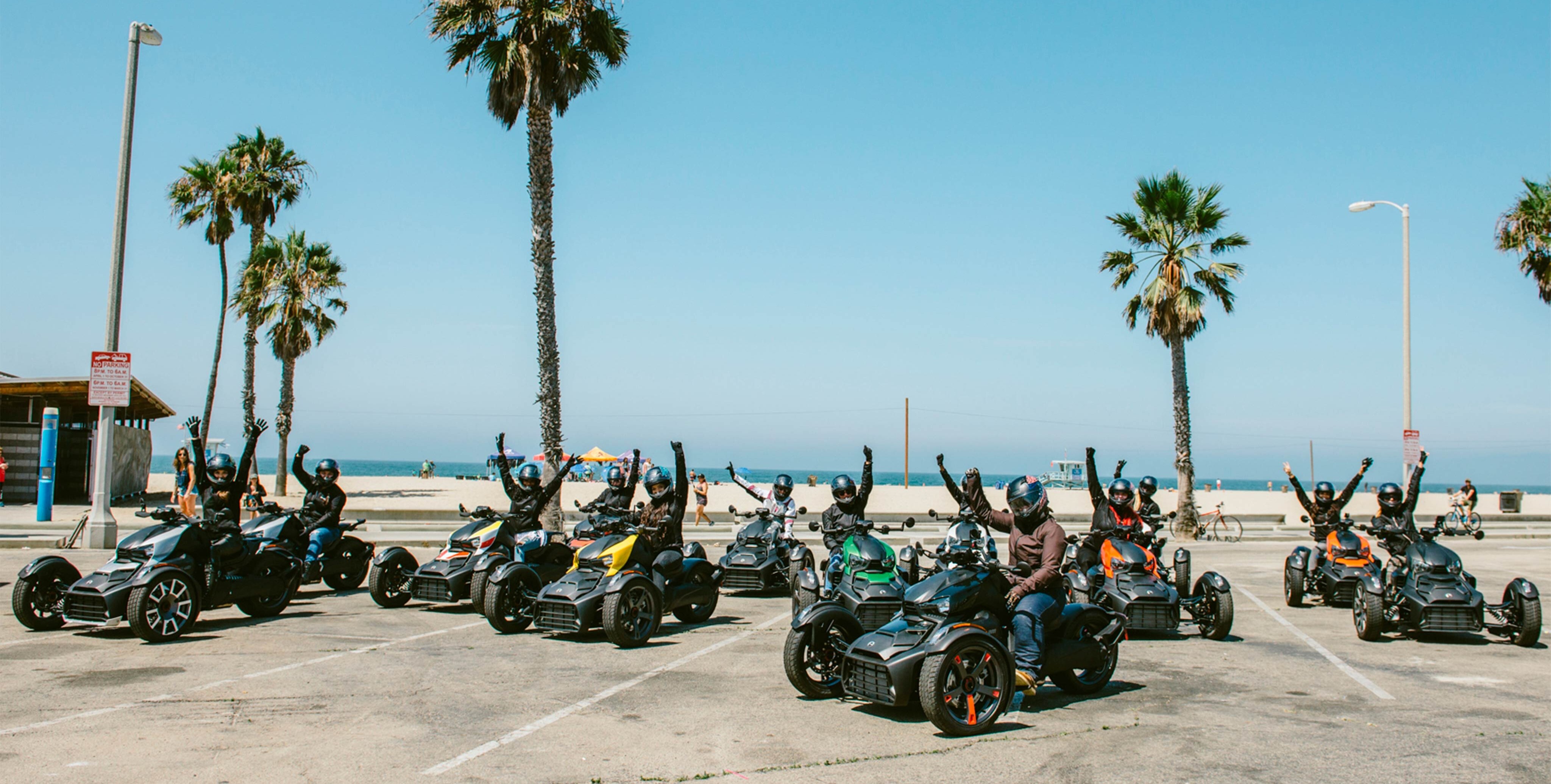 Small crowd riding their Can-Am Ryker vehicles