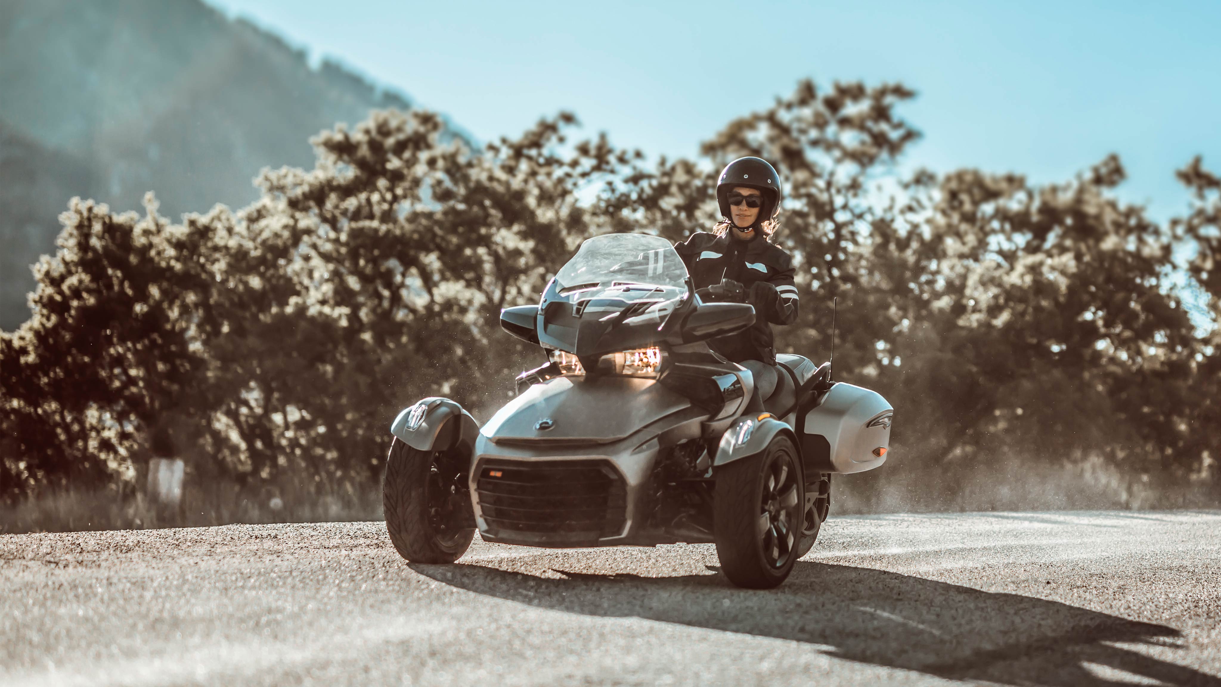 Women driving her F3 on a dusty road