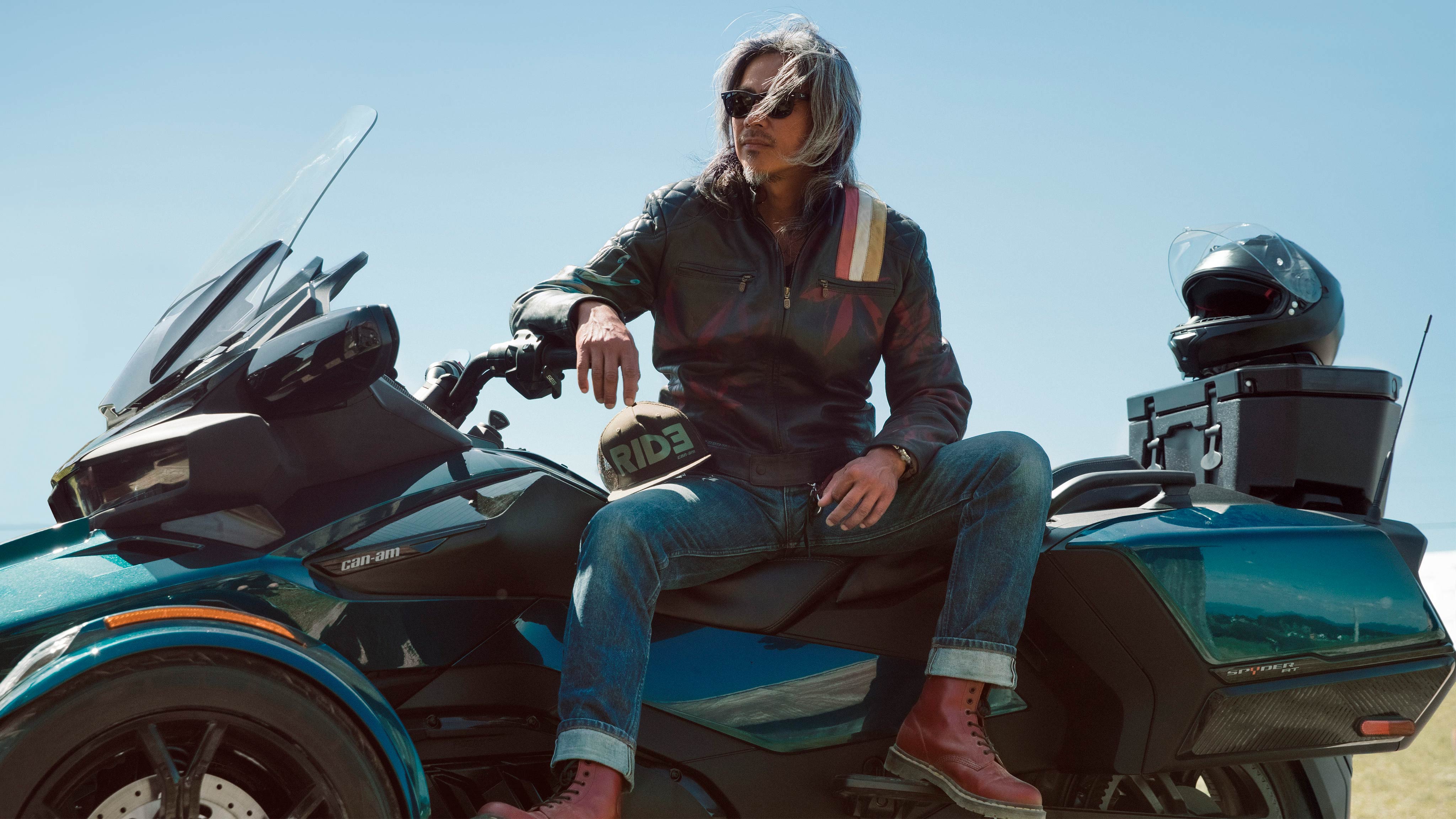 Man posing on his Can-Am Spyder RT vehicle