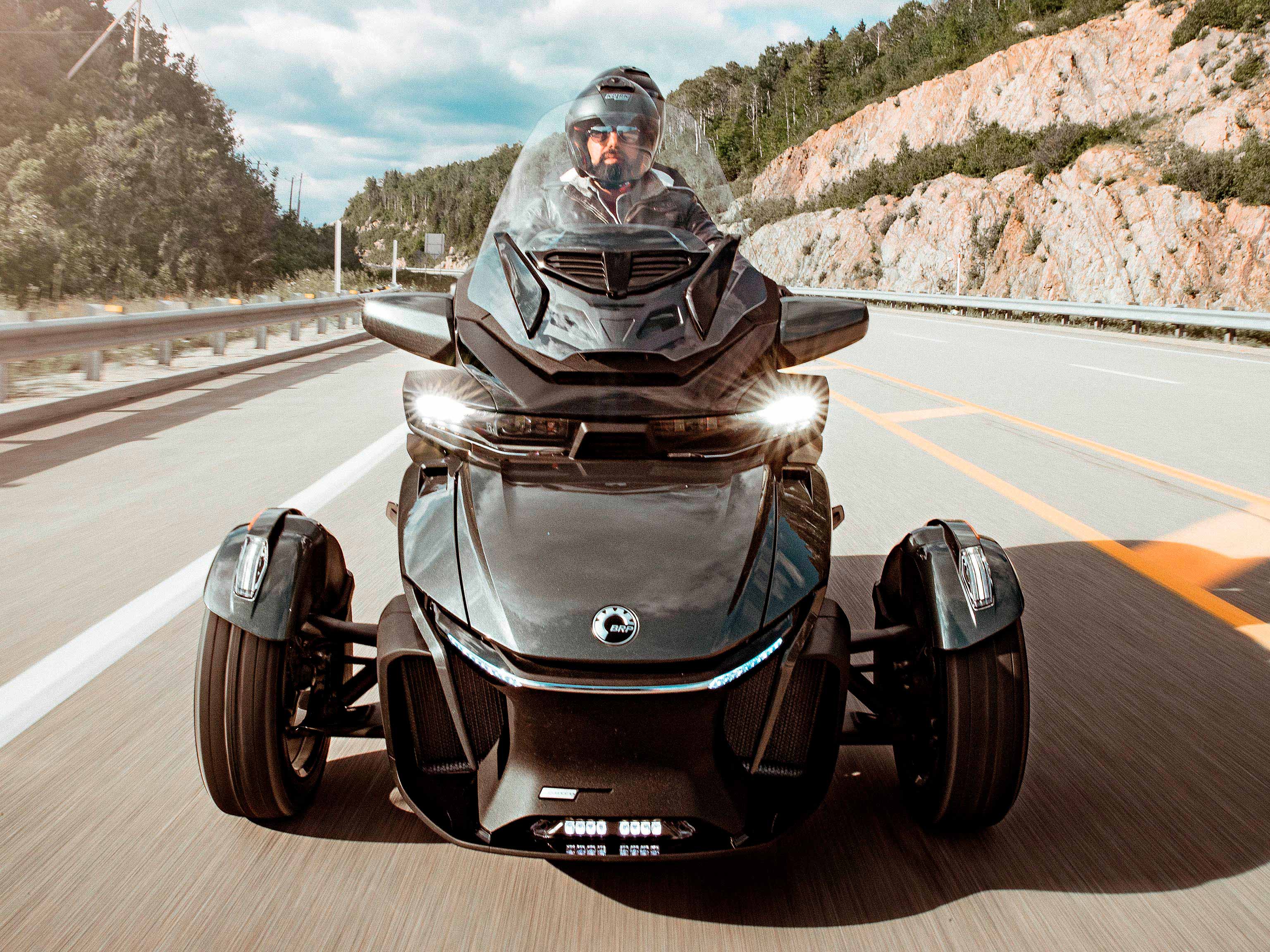 A Can-Am Spyder RT Asphalt Grey on the highway