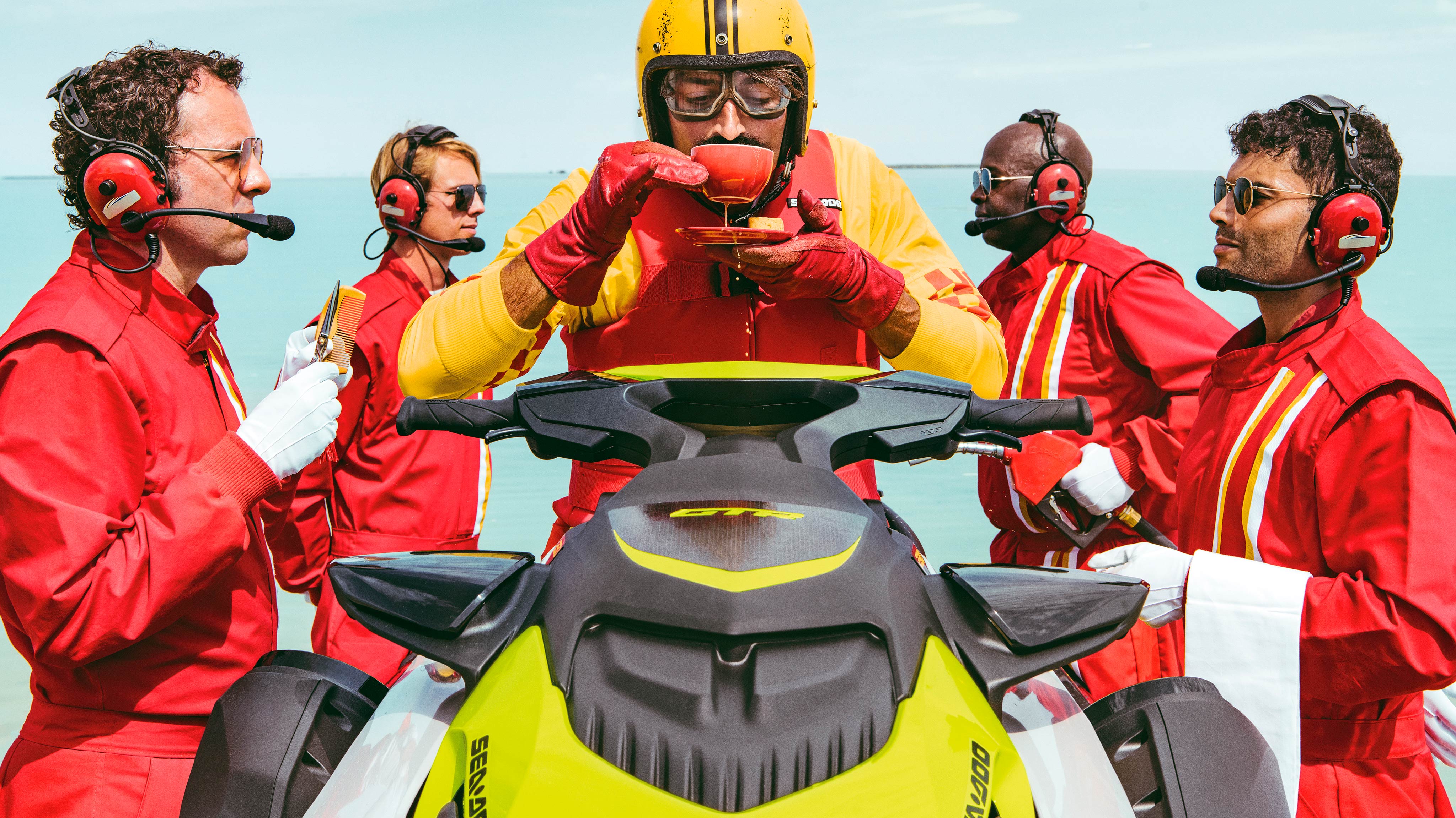 Man sipping a cup of tea on his Sea-doo personal watercraft