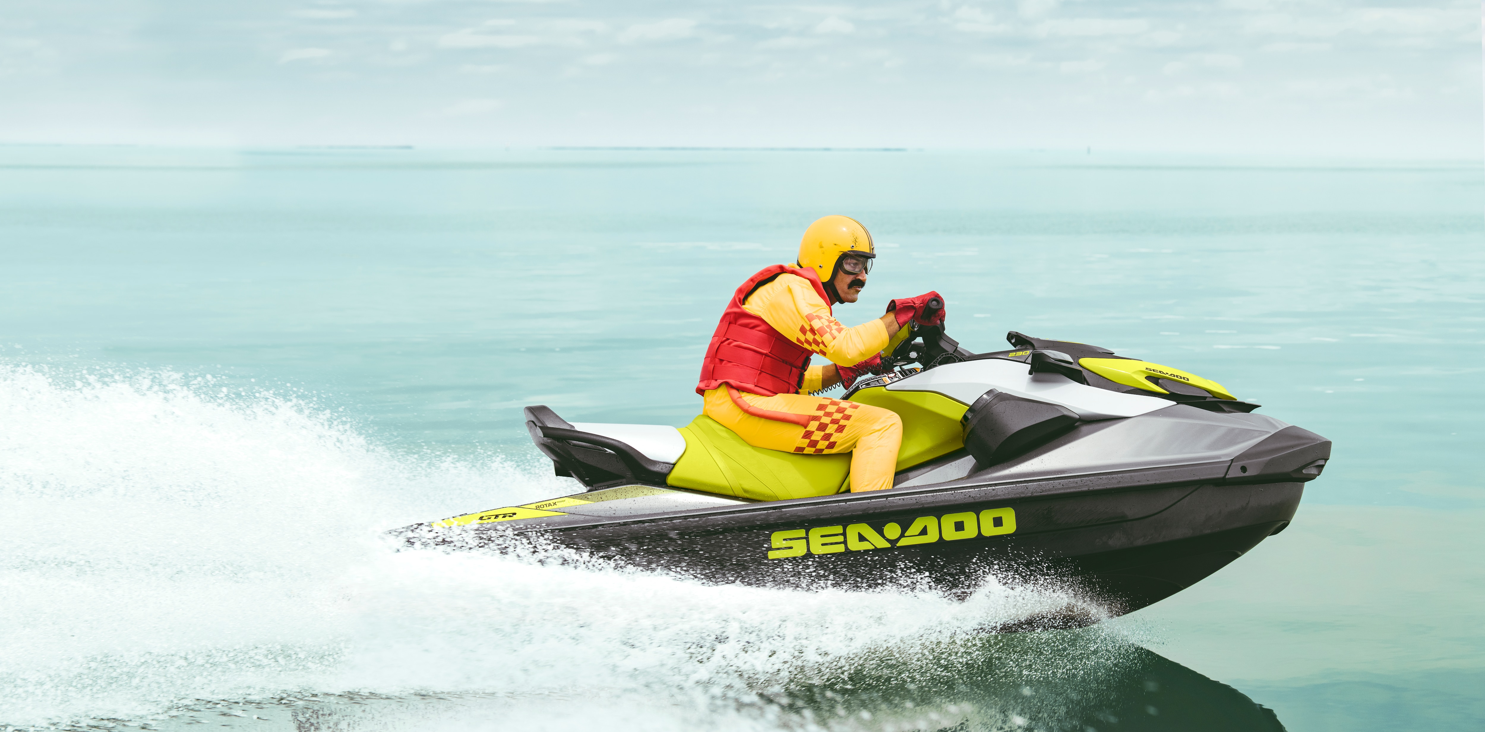 Mustached man riding his Sea-Doo GTR 