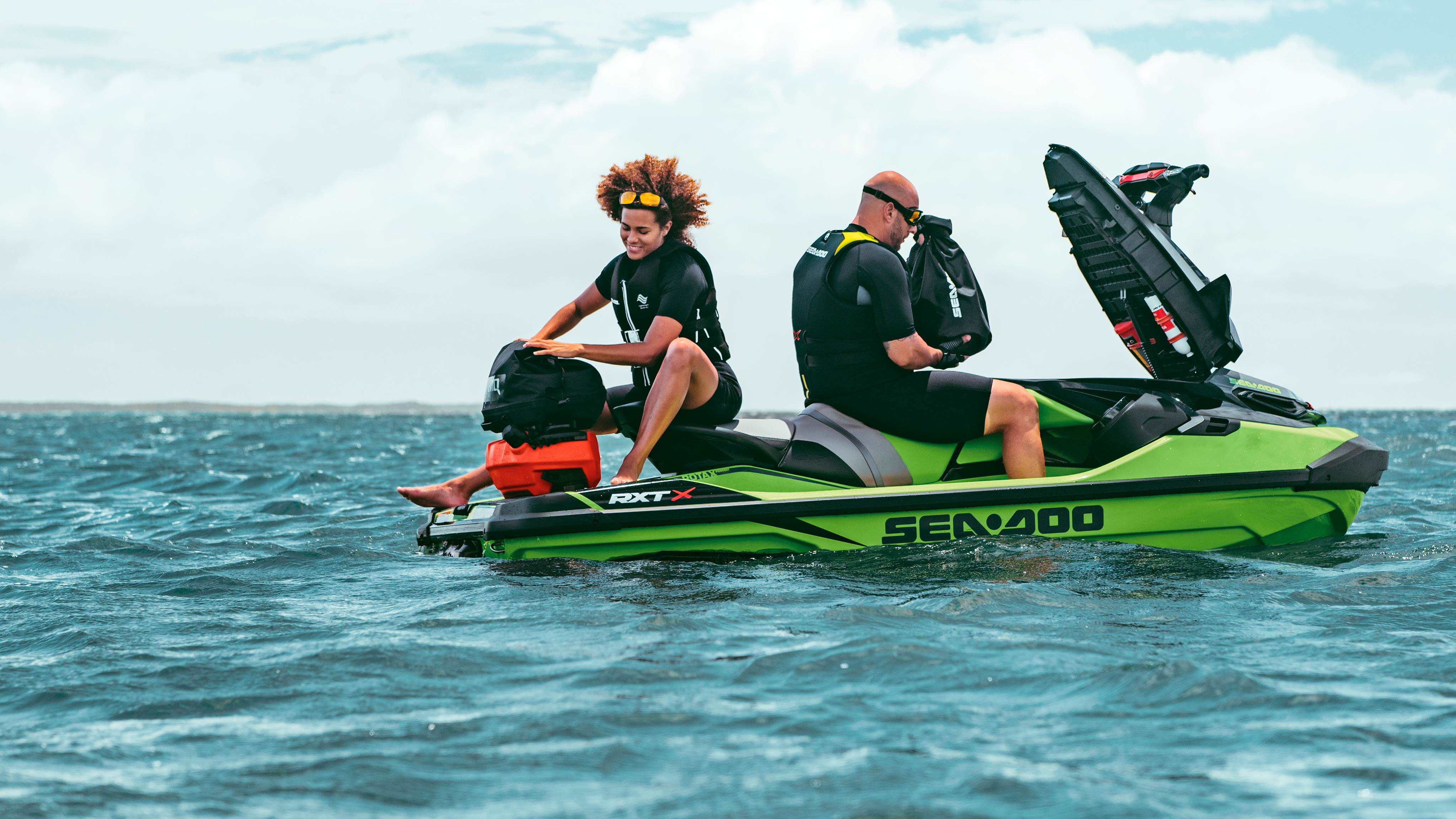 Man and woman sitting on a Sea-Doo RXT-X