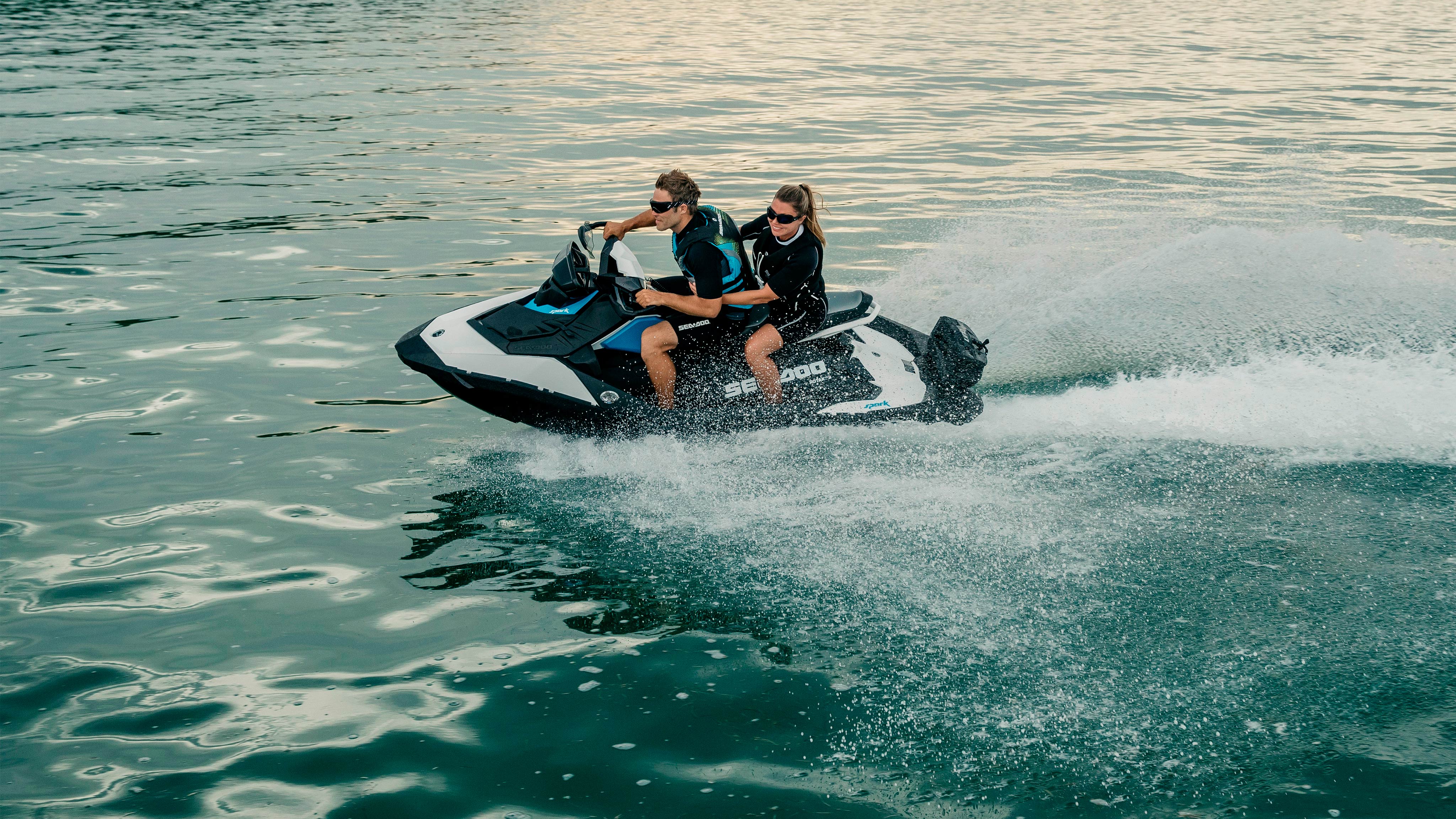 A couple riding their Sea-Doo Spark in the water