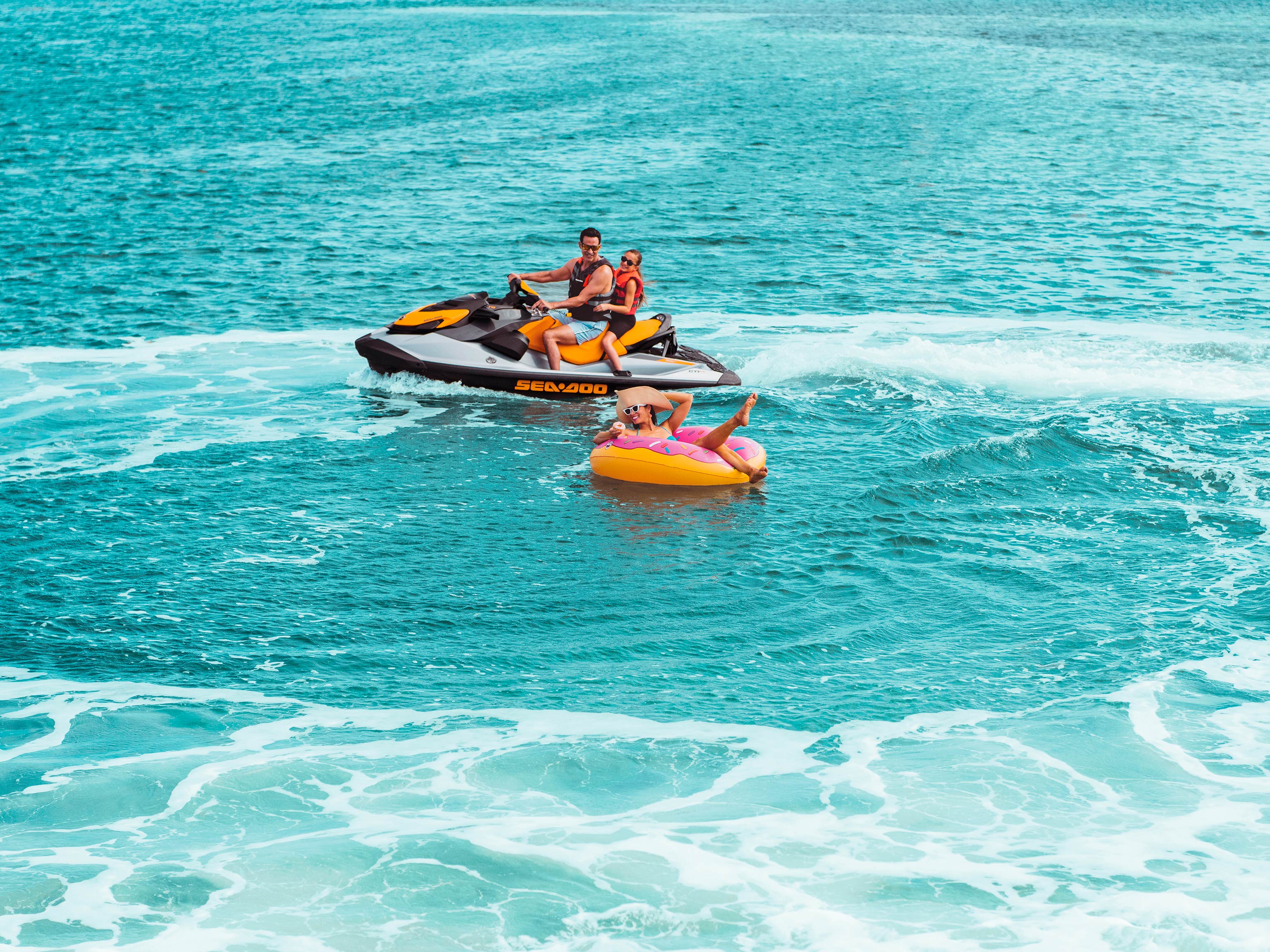 Wide angle shot of a family riding a Sea-Doo GTI SE