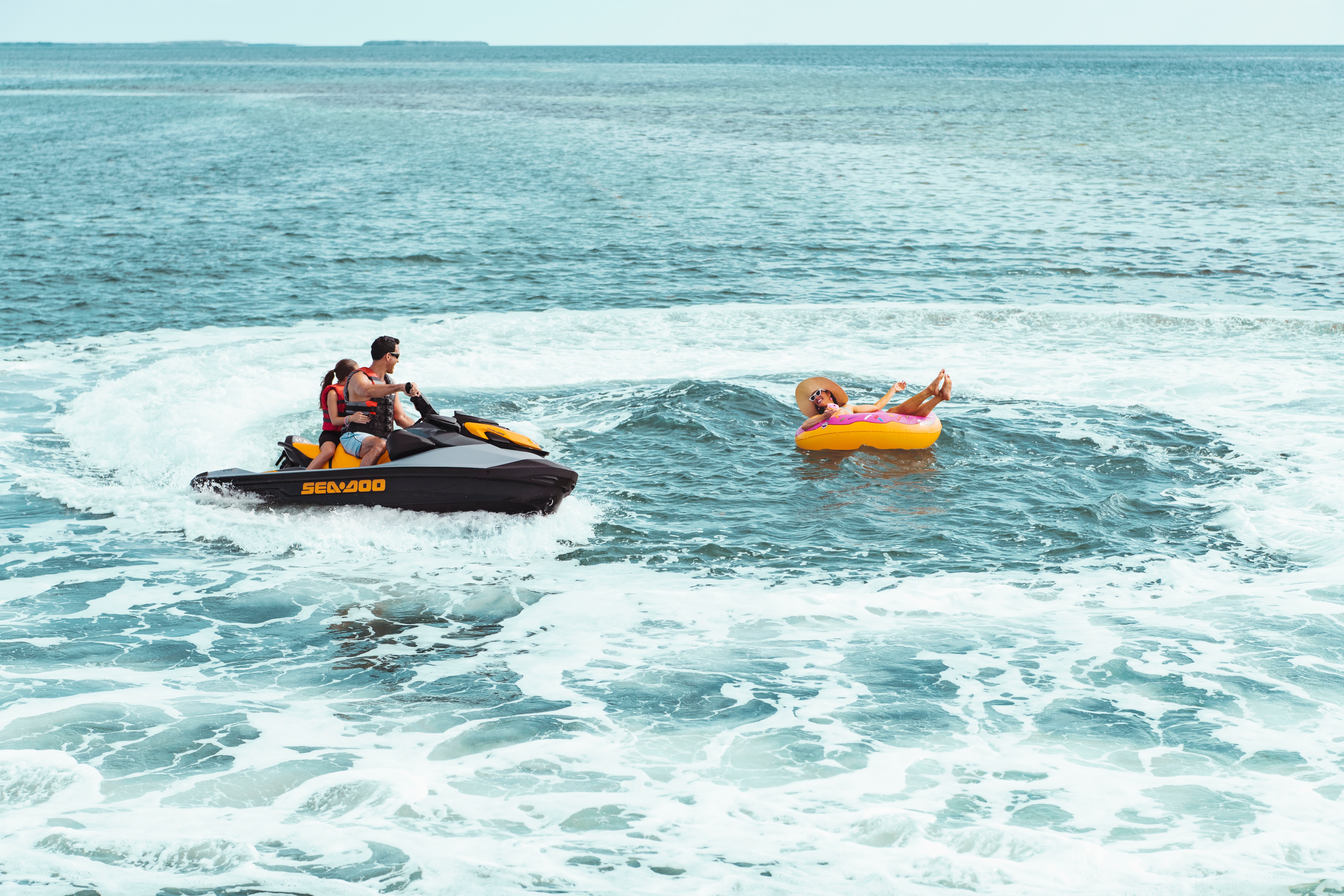 Wide angle shot of a family riding a Sea-Doo GTI SE