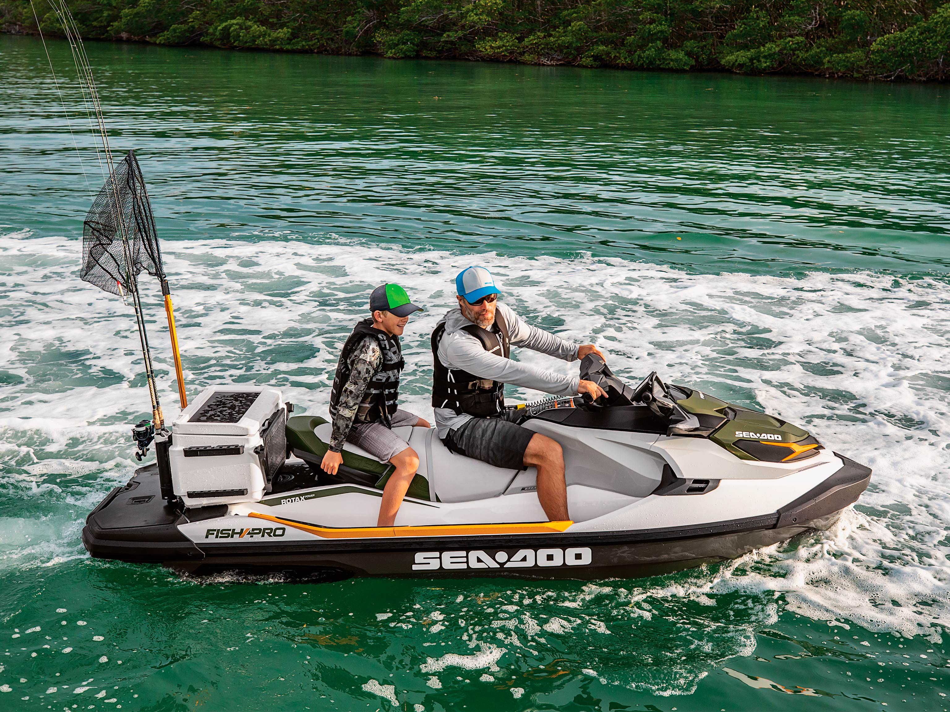 Father and son riding a Sea-Doo Fish Pro