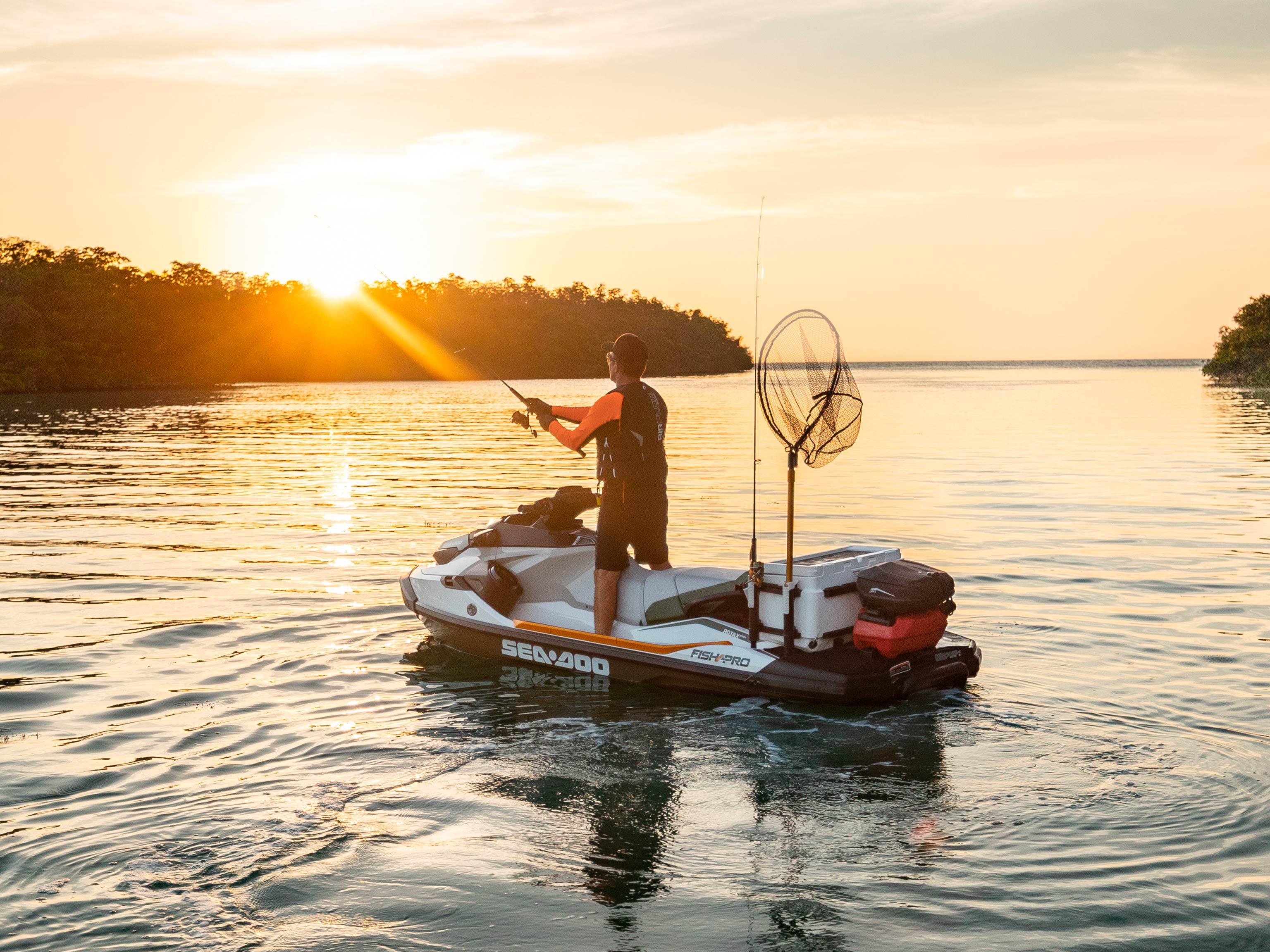 Man fishing while standing up on his Sea-Doo Fish Pro