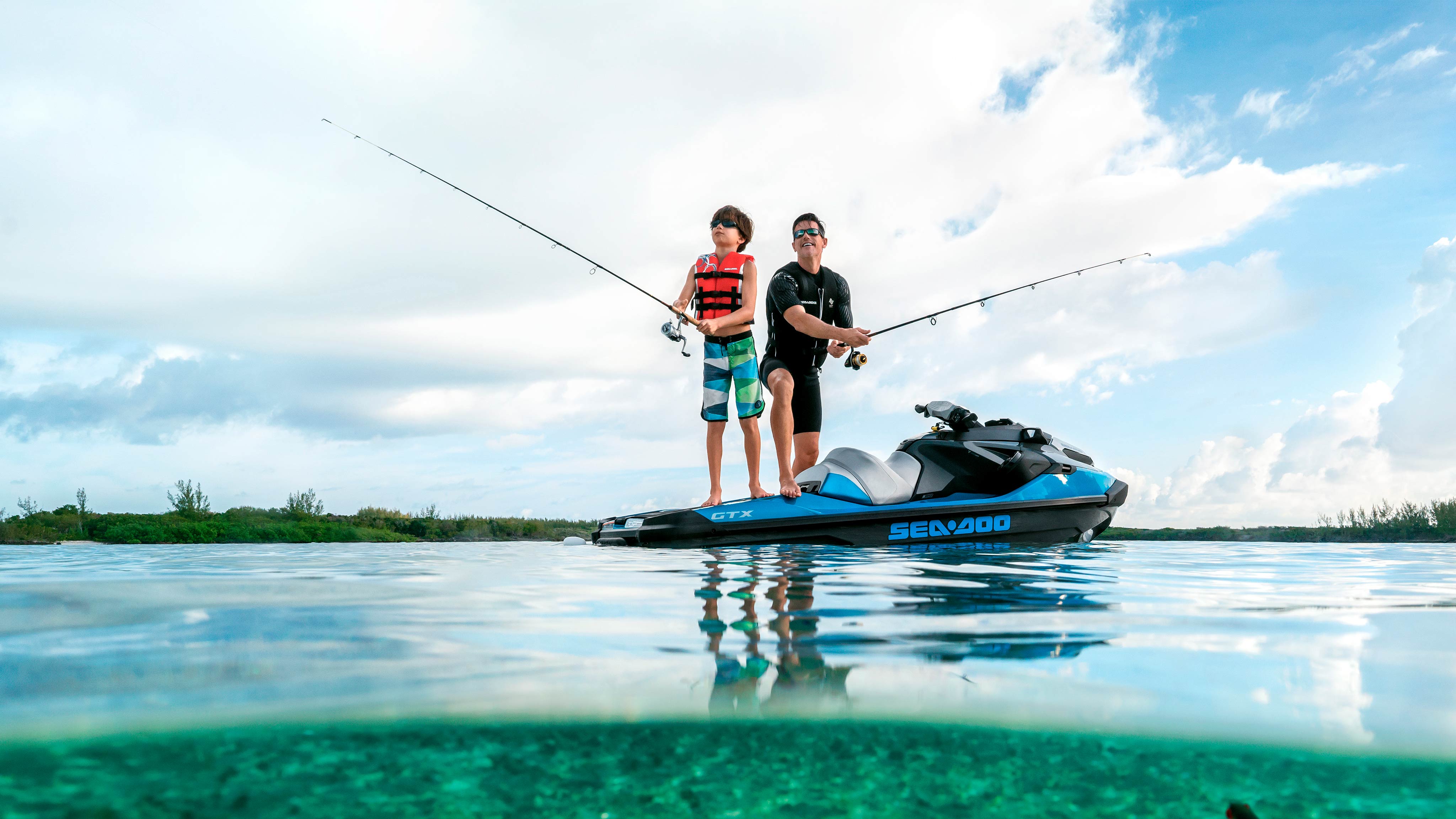 Man and his son fishing standing on a Sea-Doo GTX