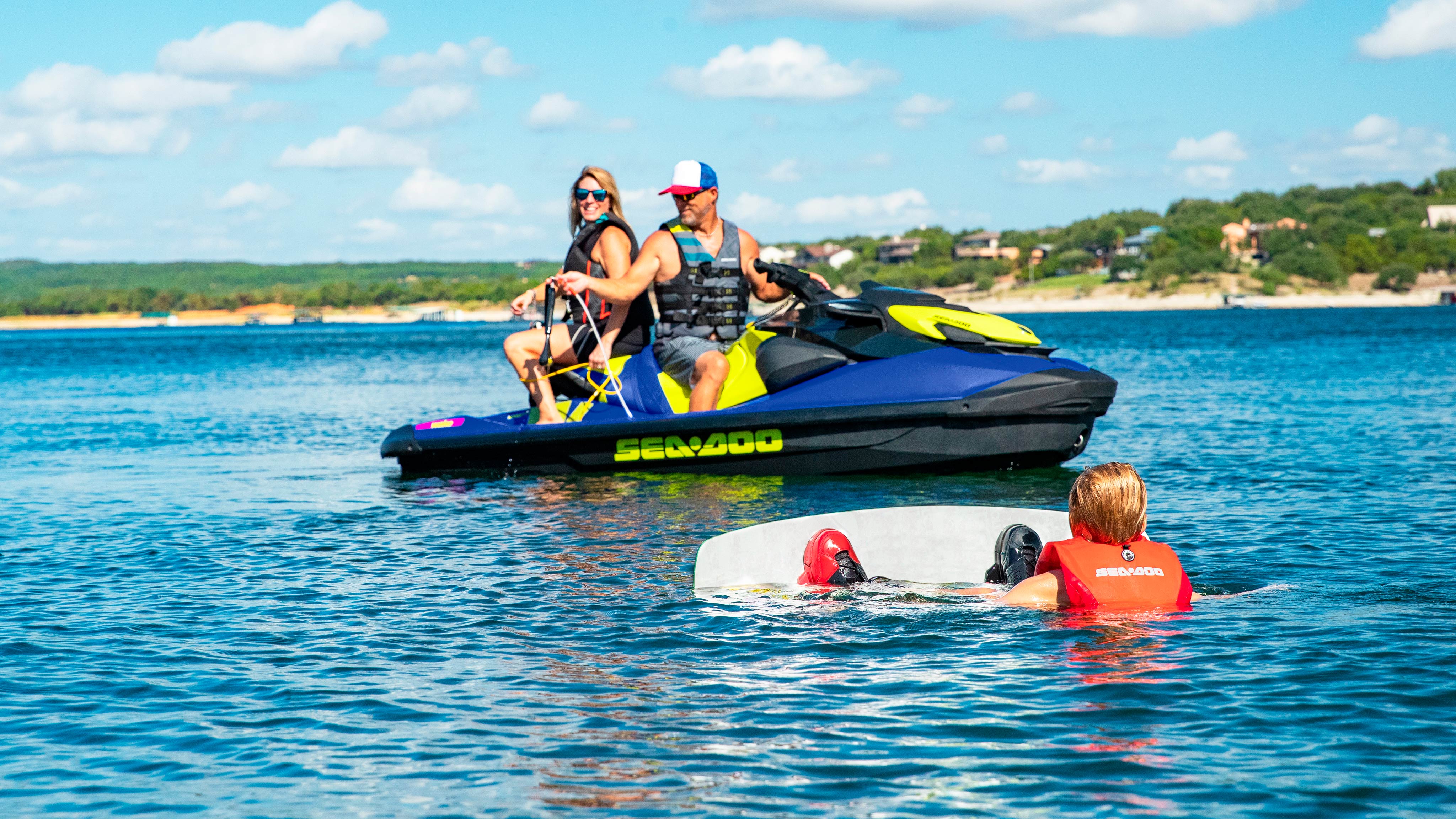 Wide angle shot of a family riding a Sea-Doo Wake 170