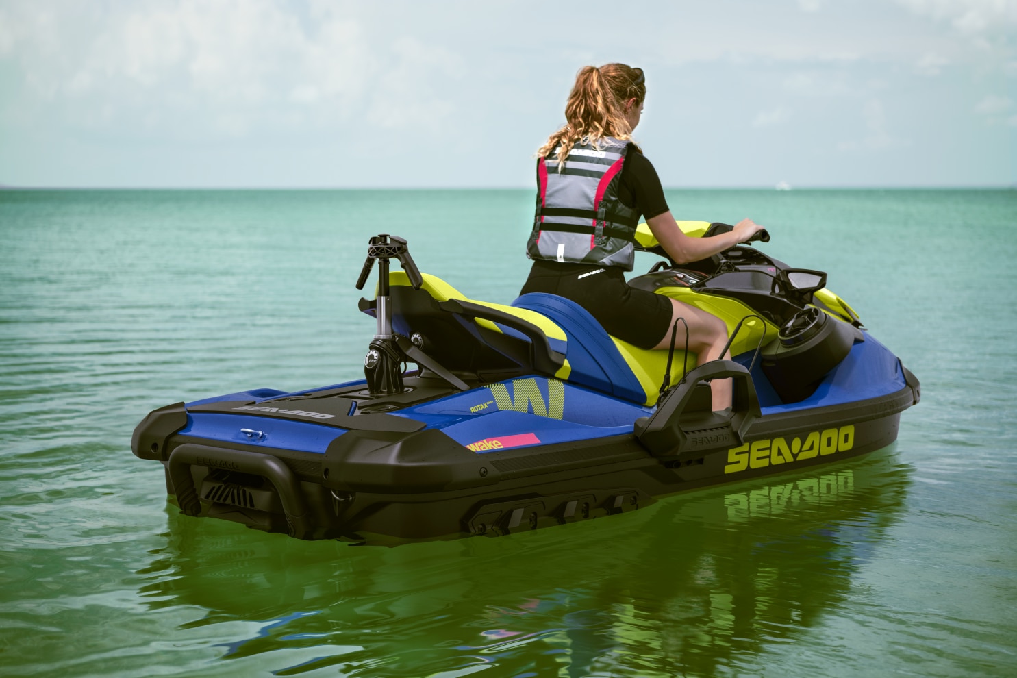 Woman riding her Sea-Doo wake