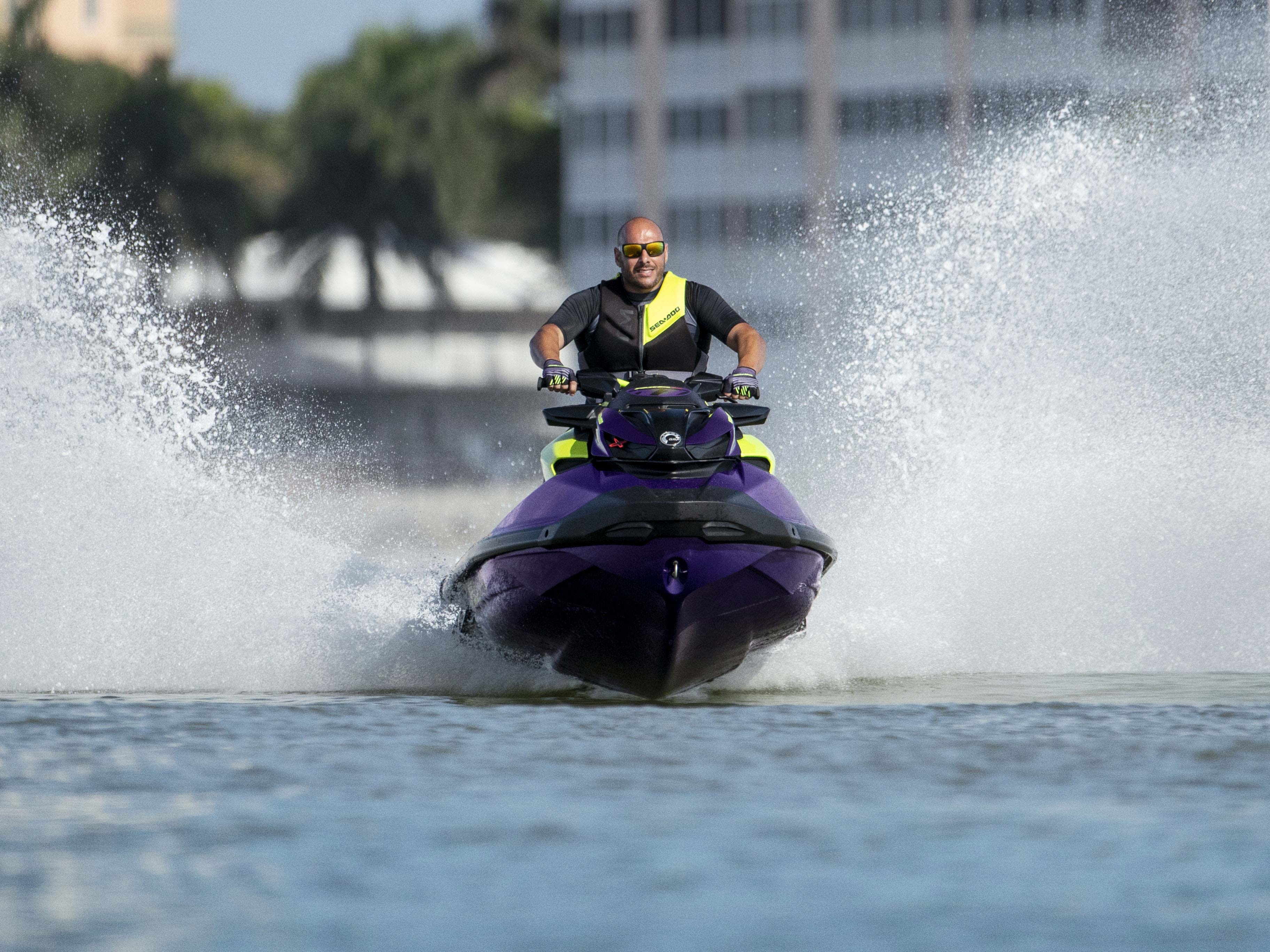 Man speeding a Sea-Doo RXP-X