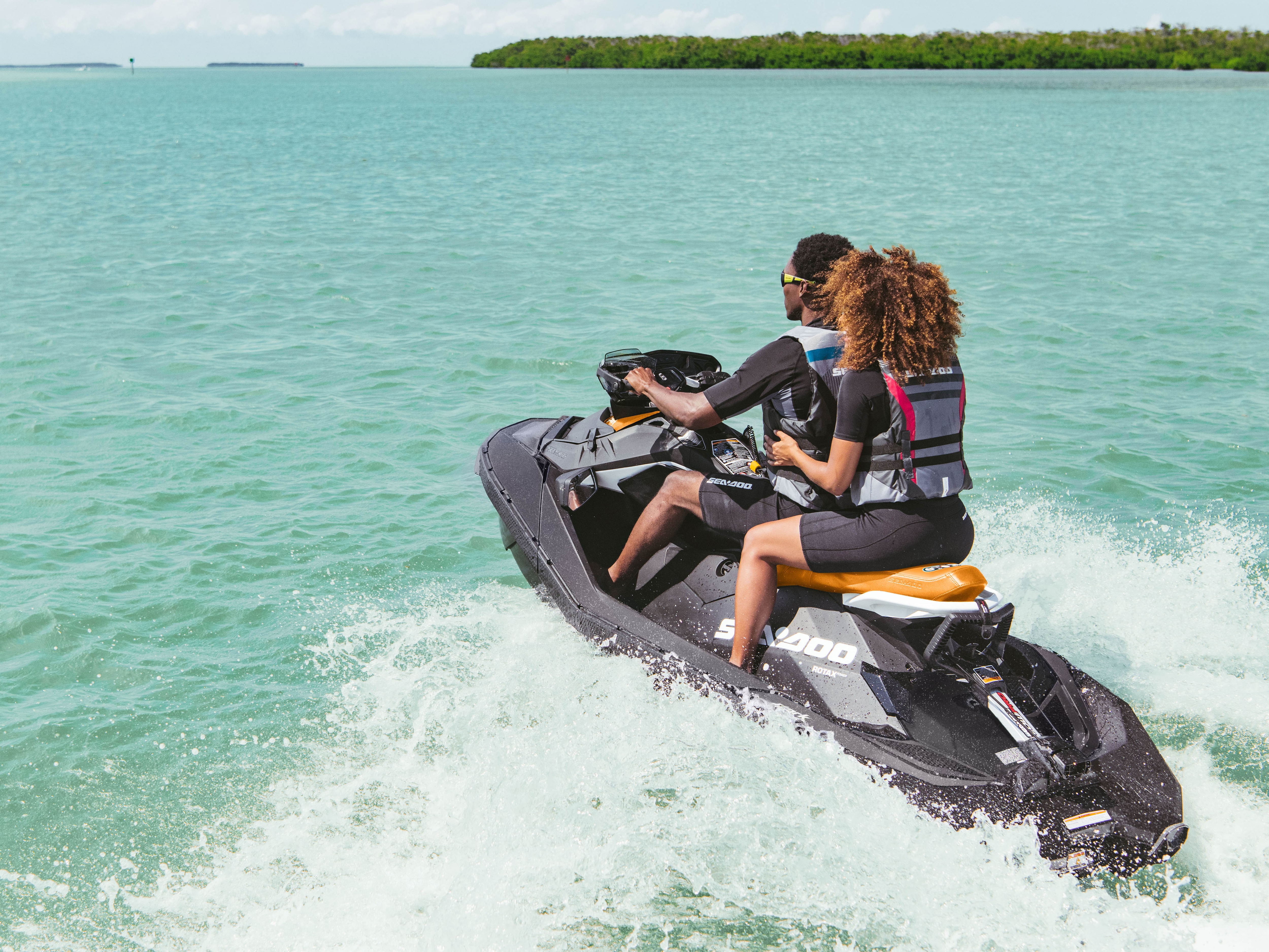 Couple riding a Sea-Doo Spark and enjoying a eco friendly pwc