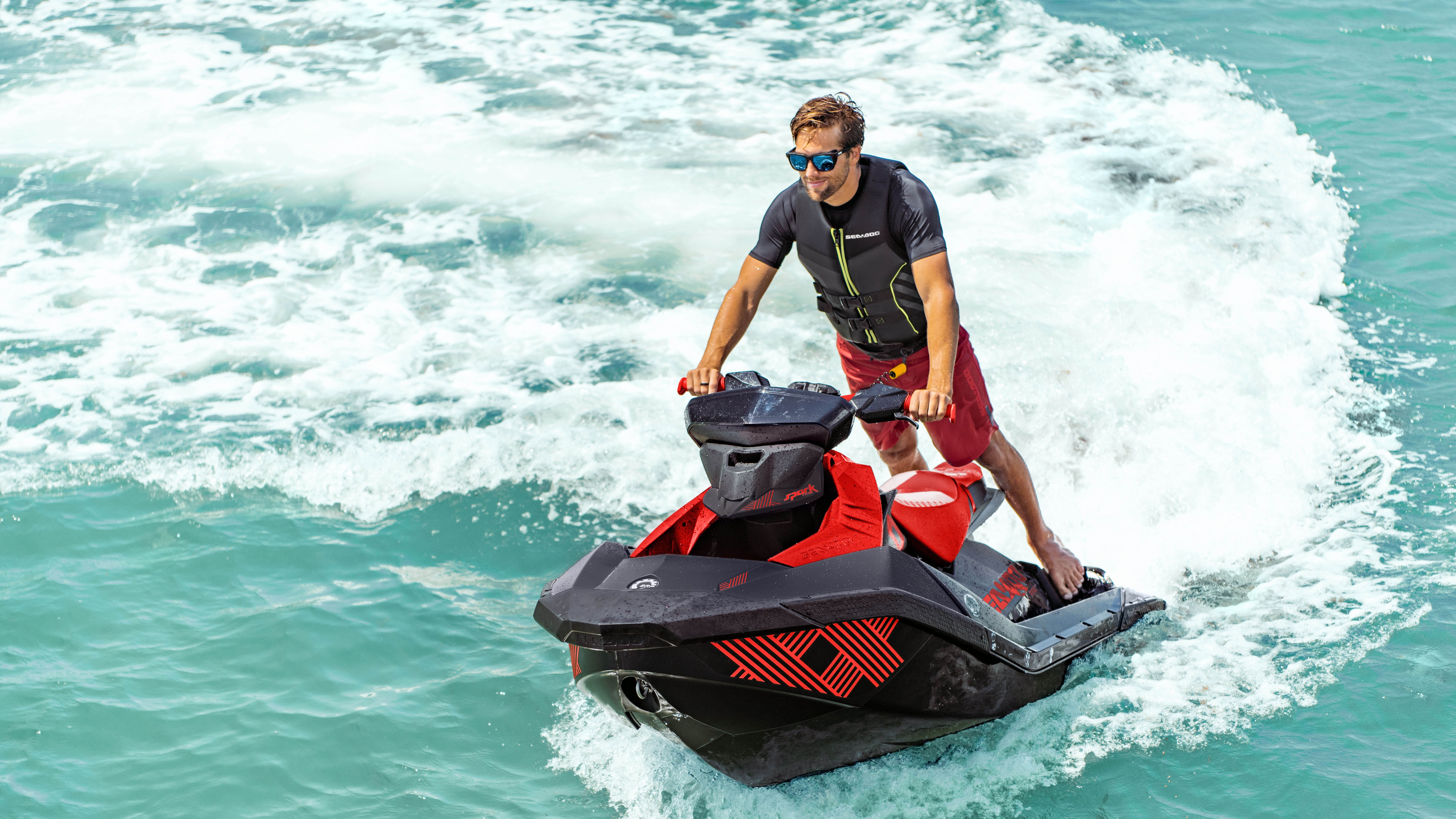 Man riding a Sea-Doo Spark Trixx with Polytec design