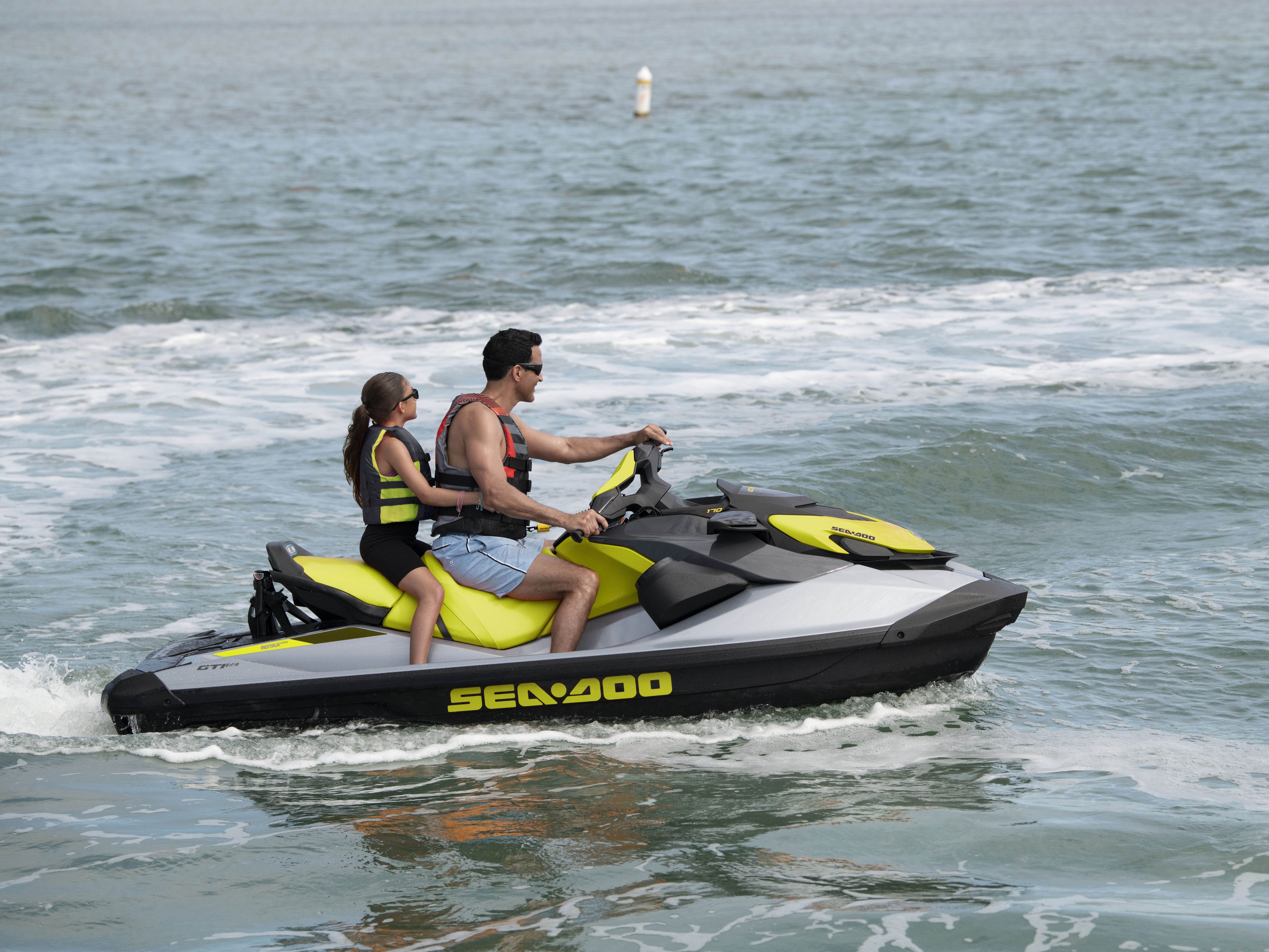 Couple riding a Sea-Doo GTI SE 