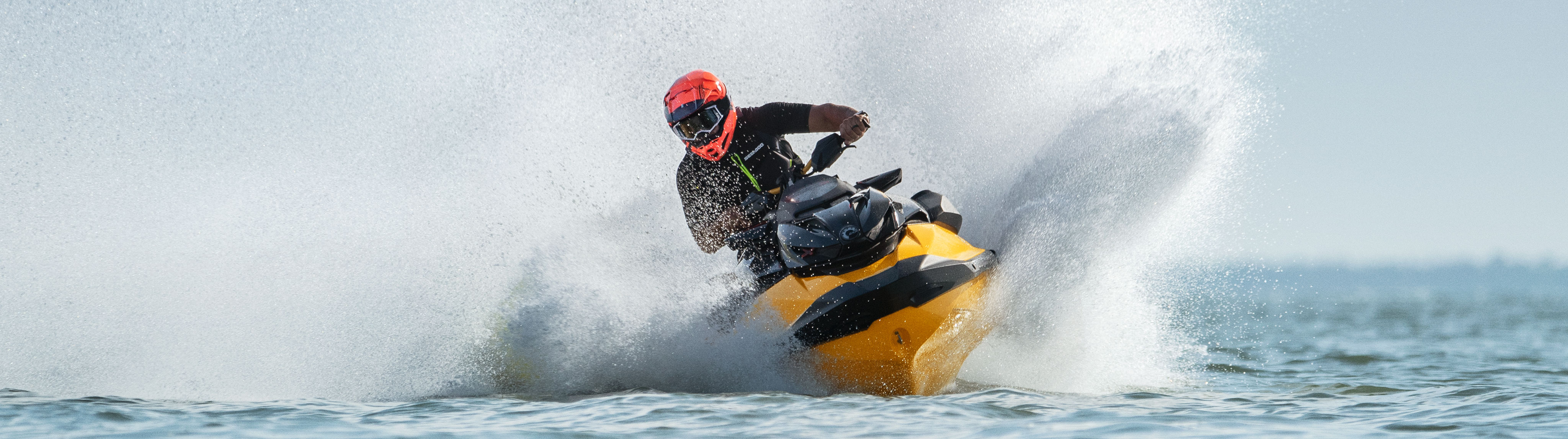 Men riding fast on his Sea-Doo RXP-X 