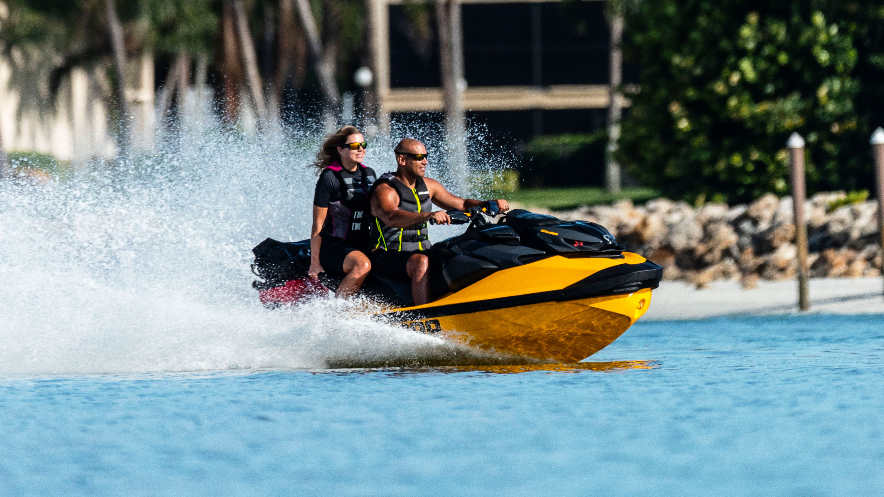 Couple riding a Sea-Doo RXP-X