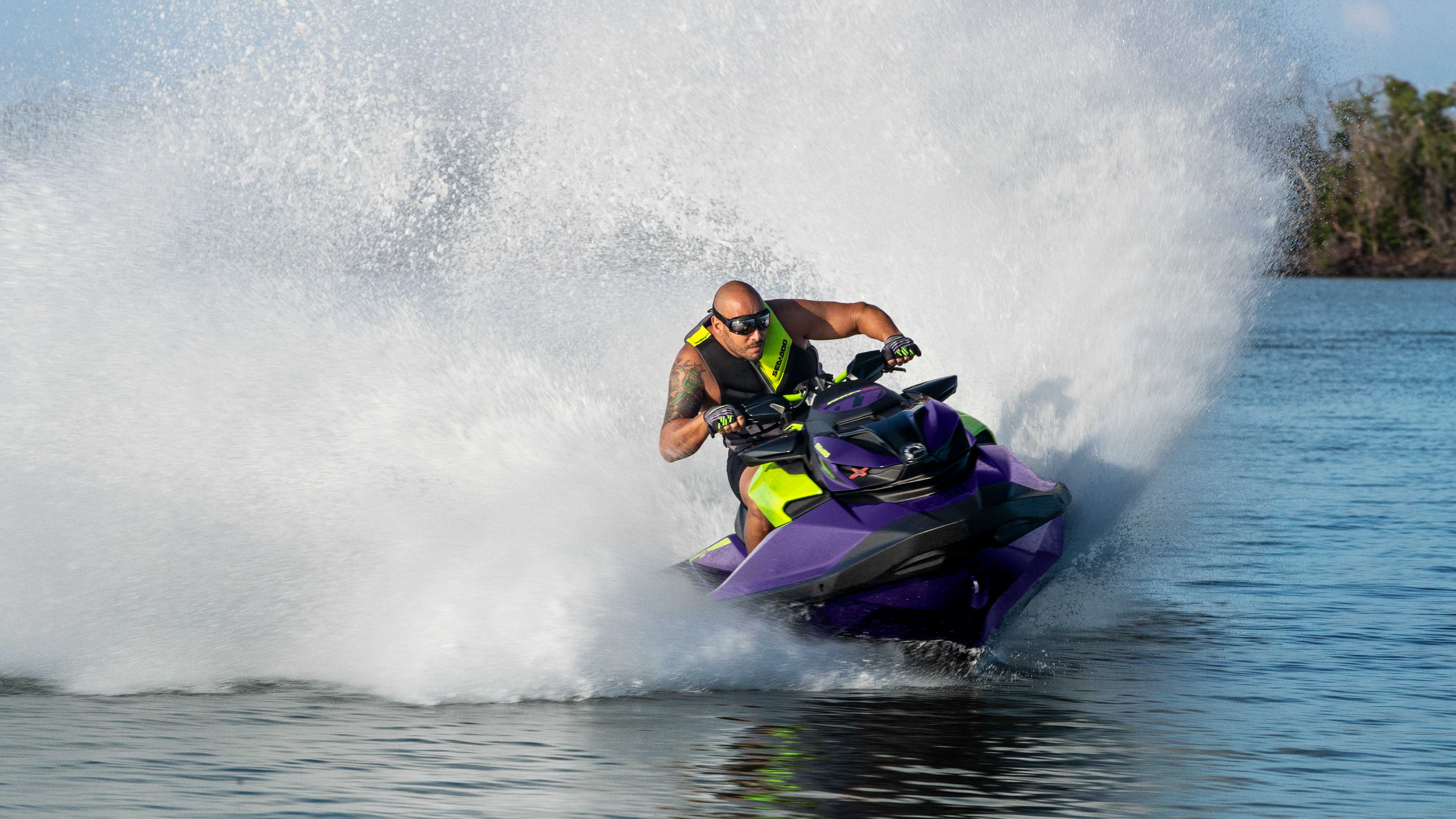 Men speeding with a Sea-Doo RXP-X