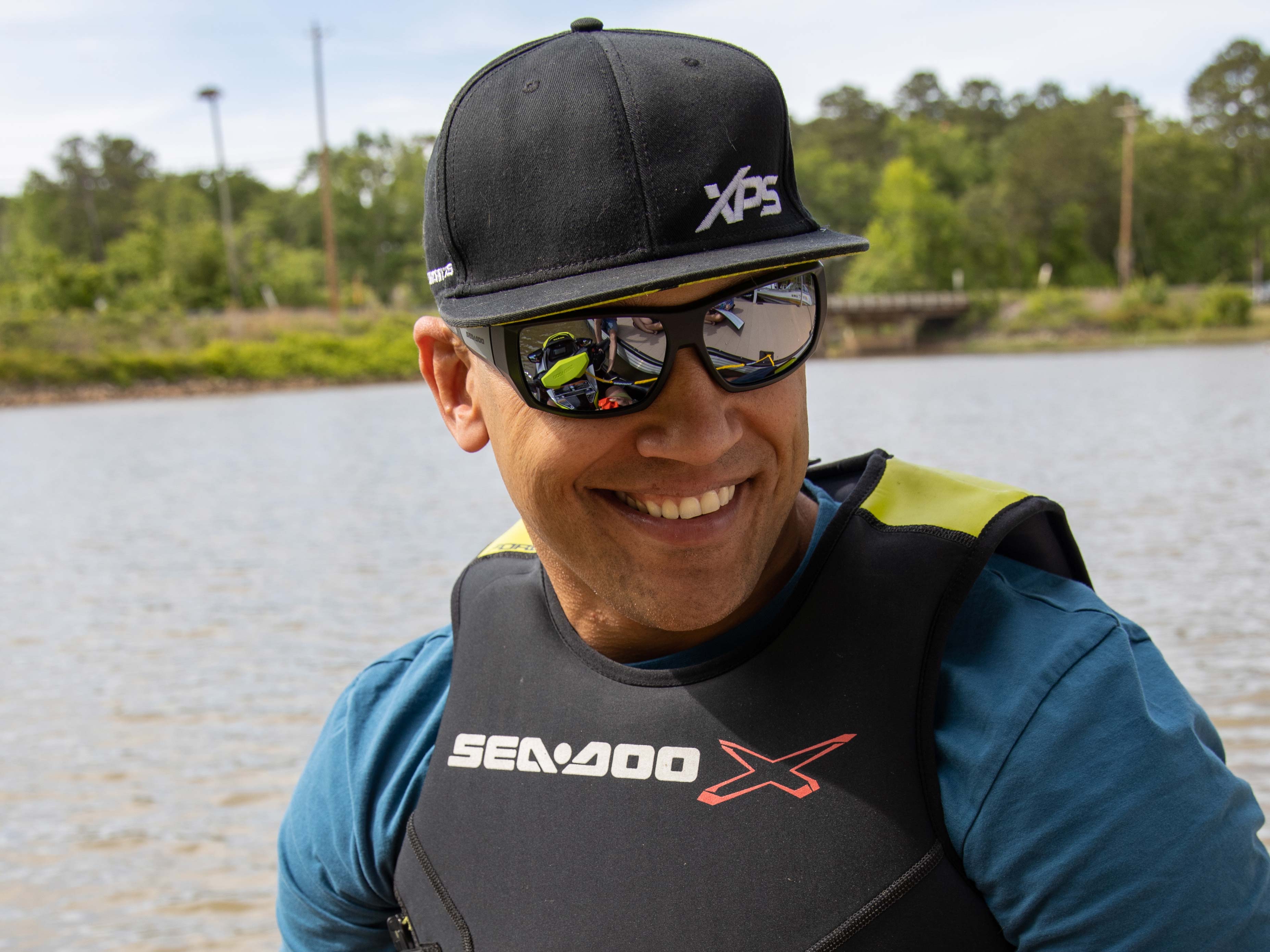 Anthony Radetic smiling with a XPS cap