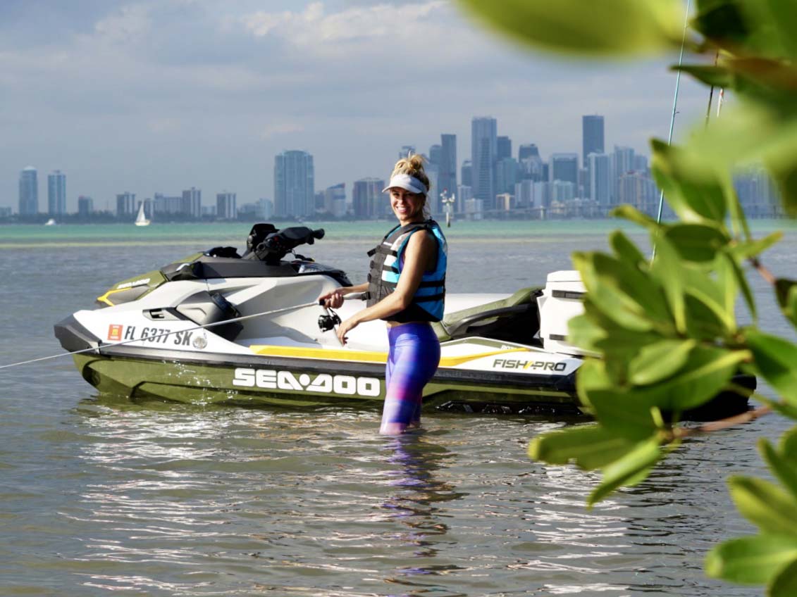 Bri Andrassy fishing beside her Sea-Doo Fish Pro