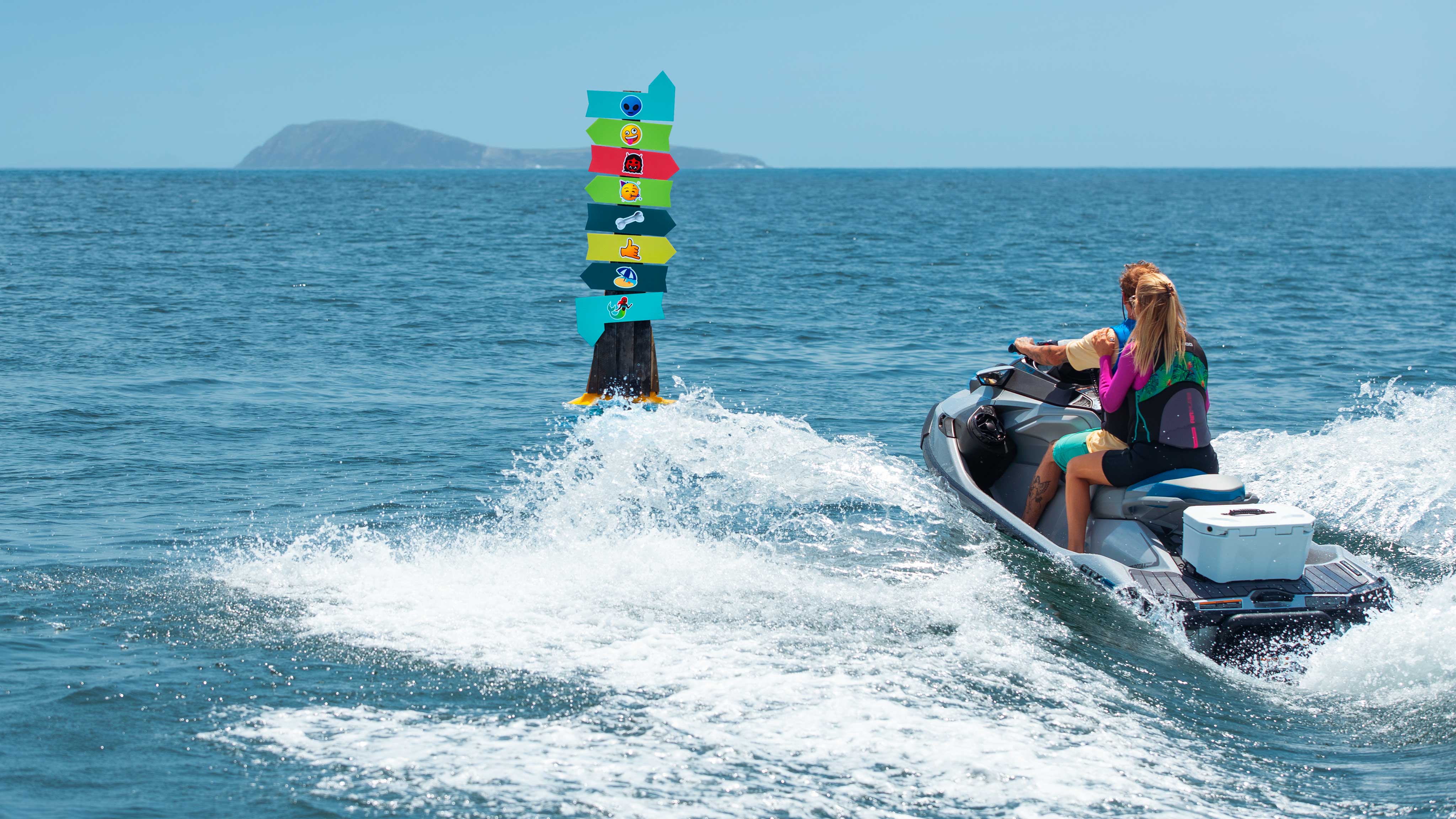 Couple riding a Sea-Doo GTX Limited