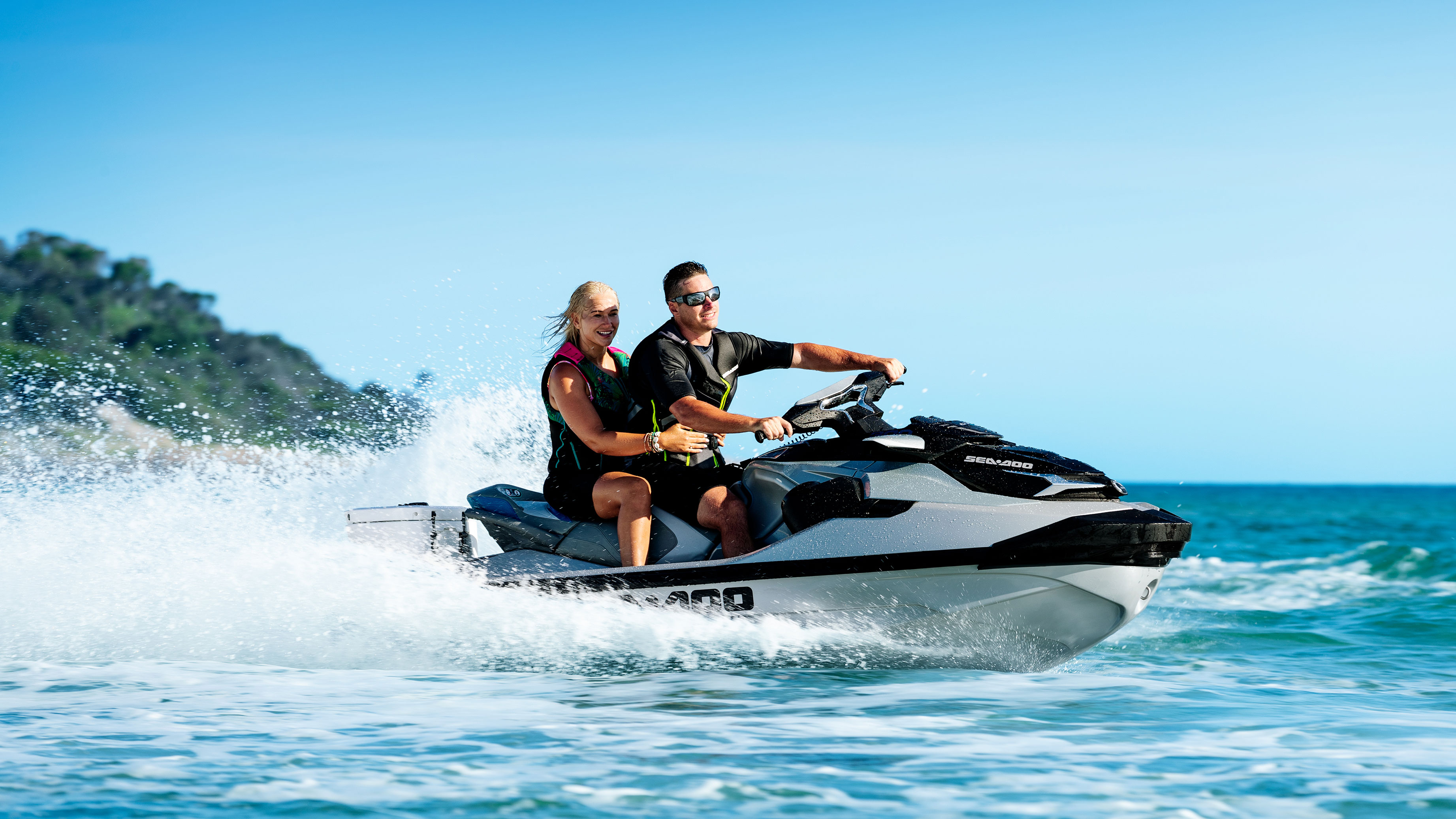 Couple riding a Sea-Doo GTX Limited