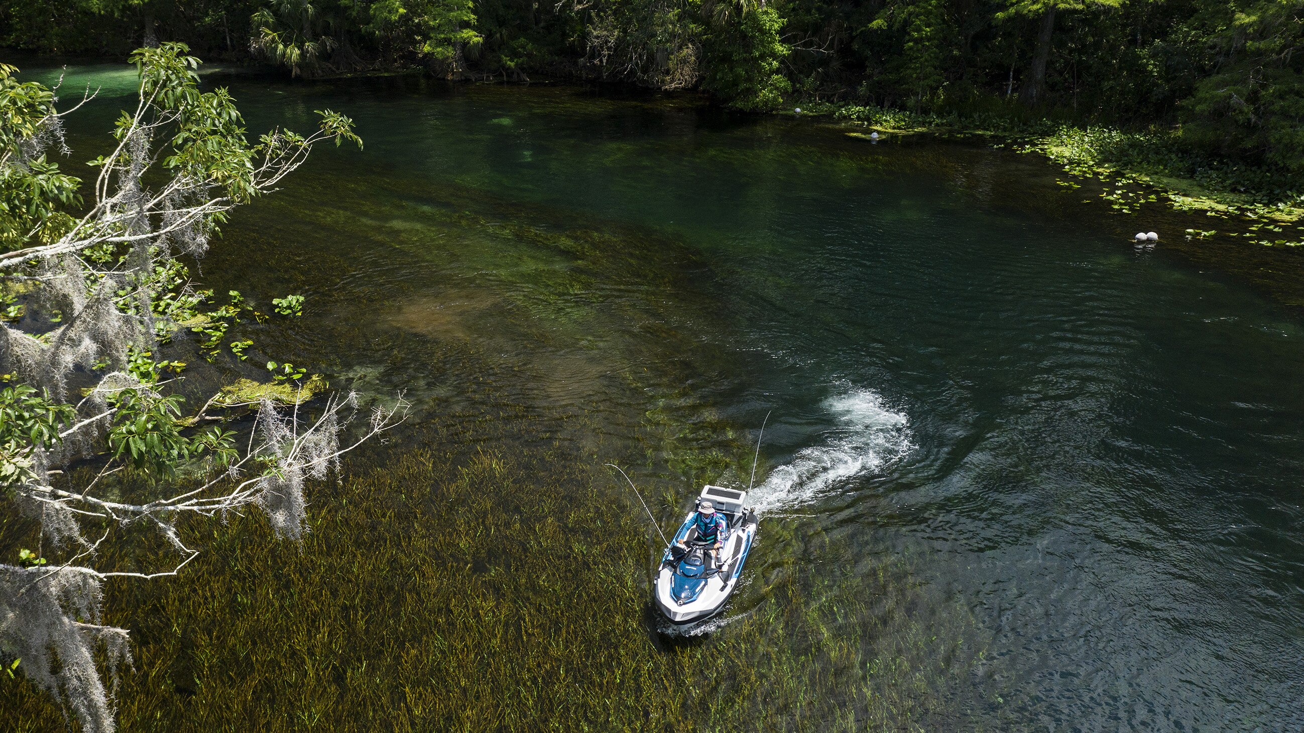 Woman riding a Sea-Doo Fish Pro in a river