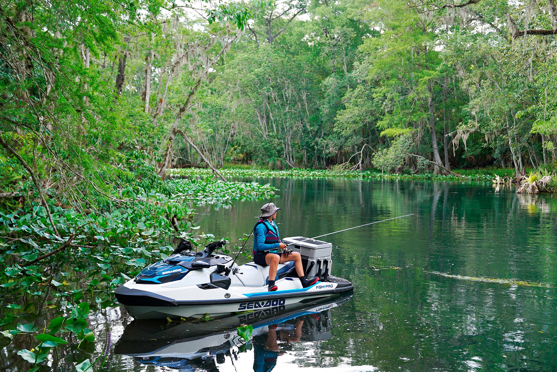 Woman fishing on her Sea-Doo Fish Pro