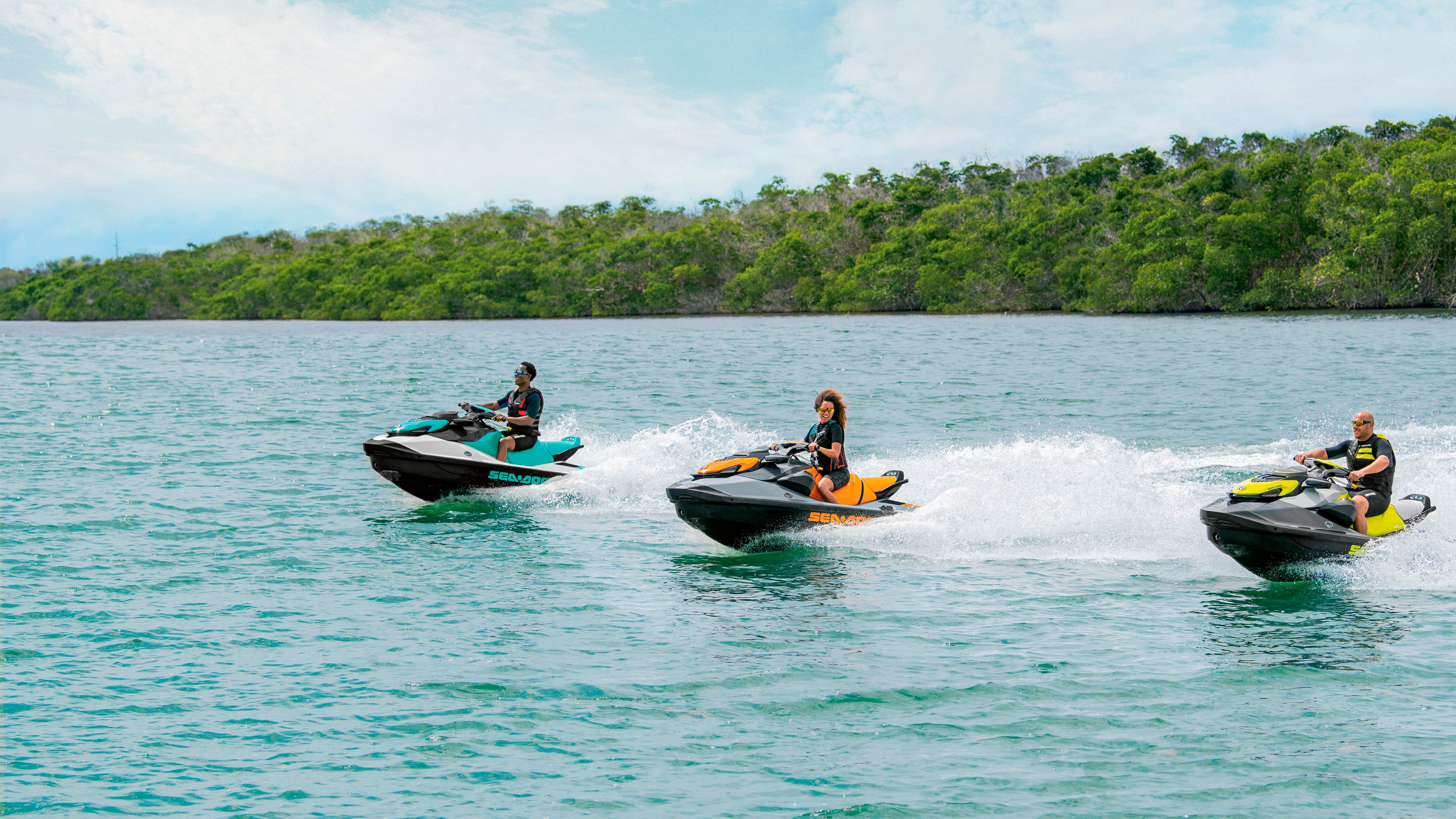 A man and a woman riding a Sea-Doo GTI