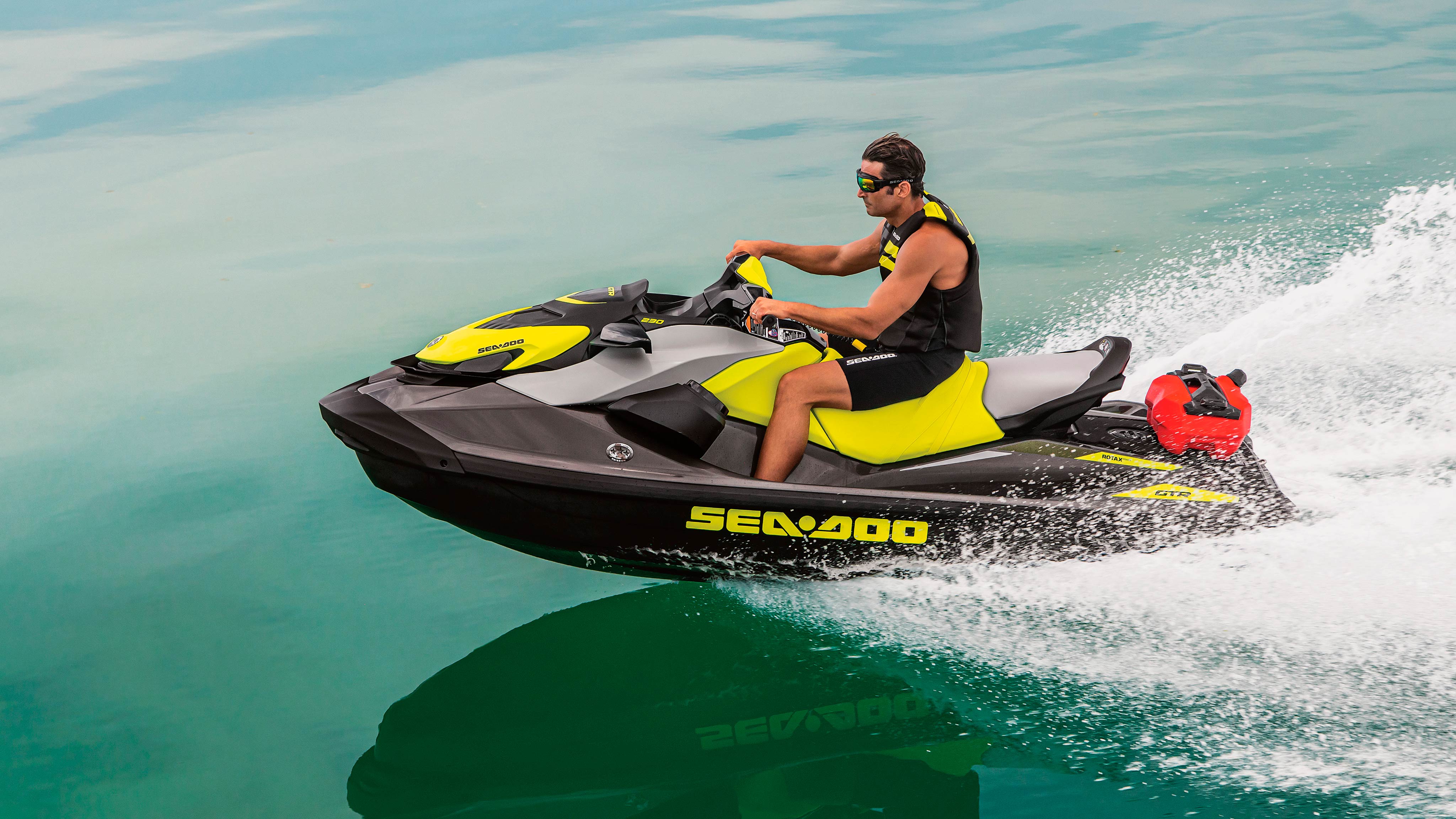 Mustached man riding his Sea-Doo GTR 