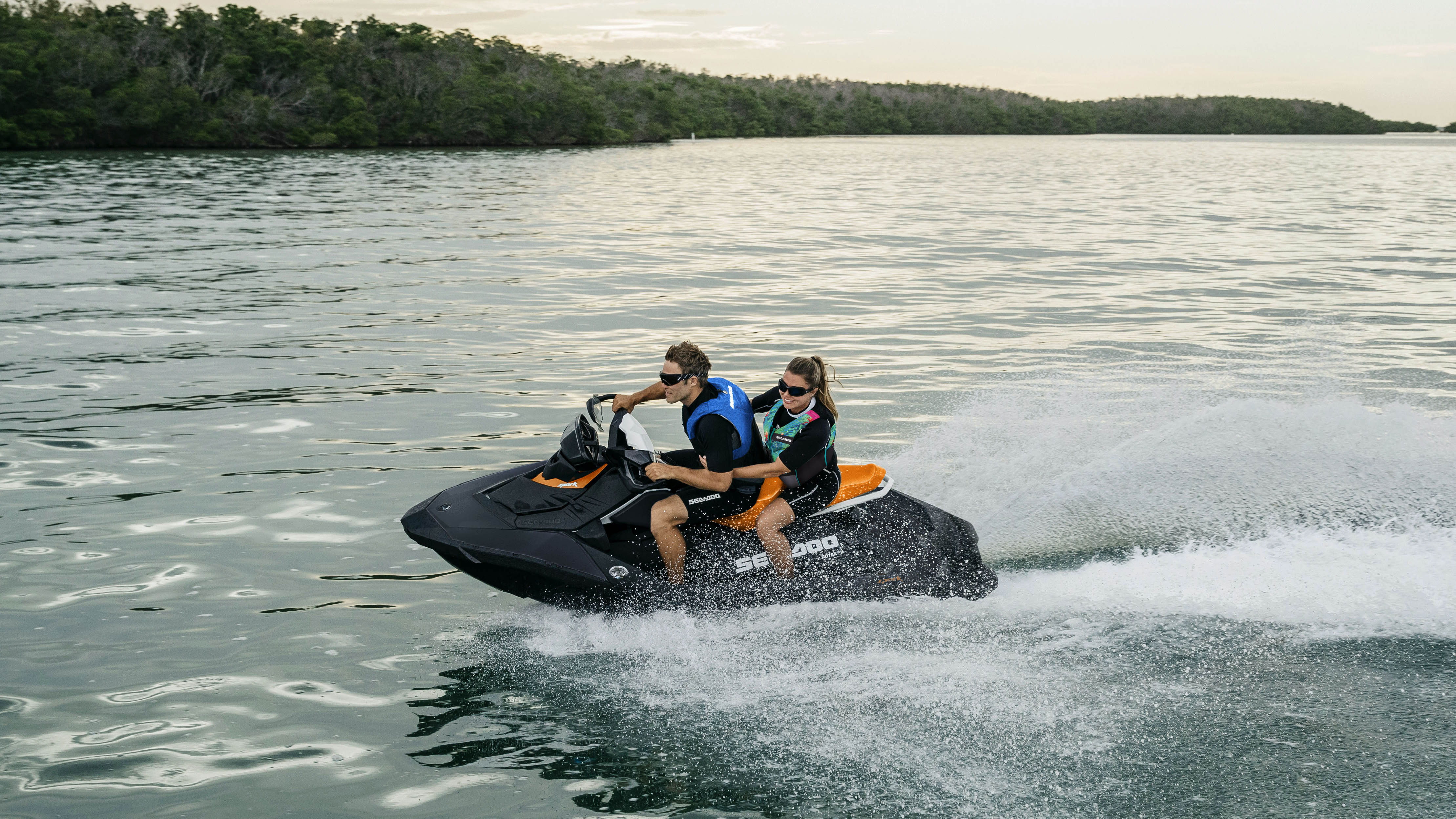 Couple riding a Sea-Doo spark with 2-3 seating feature