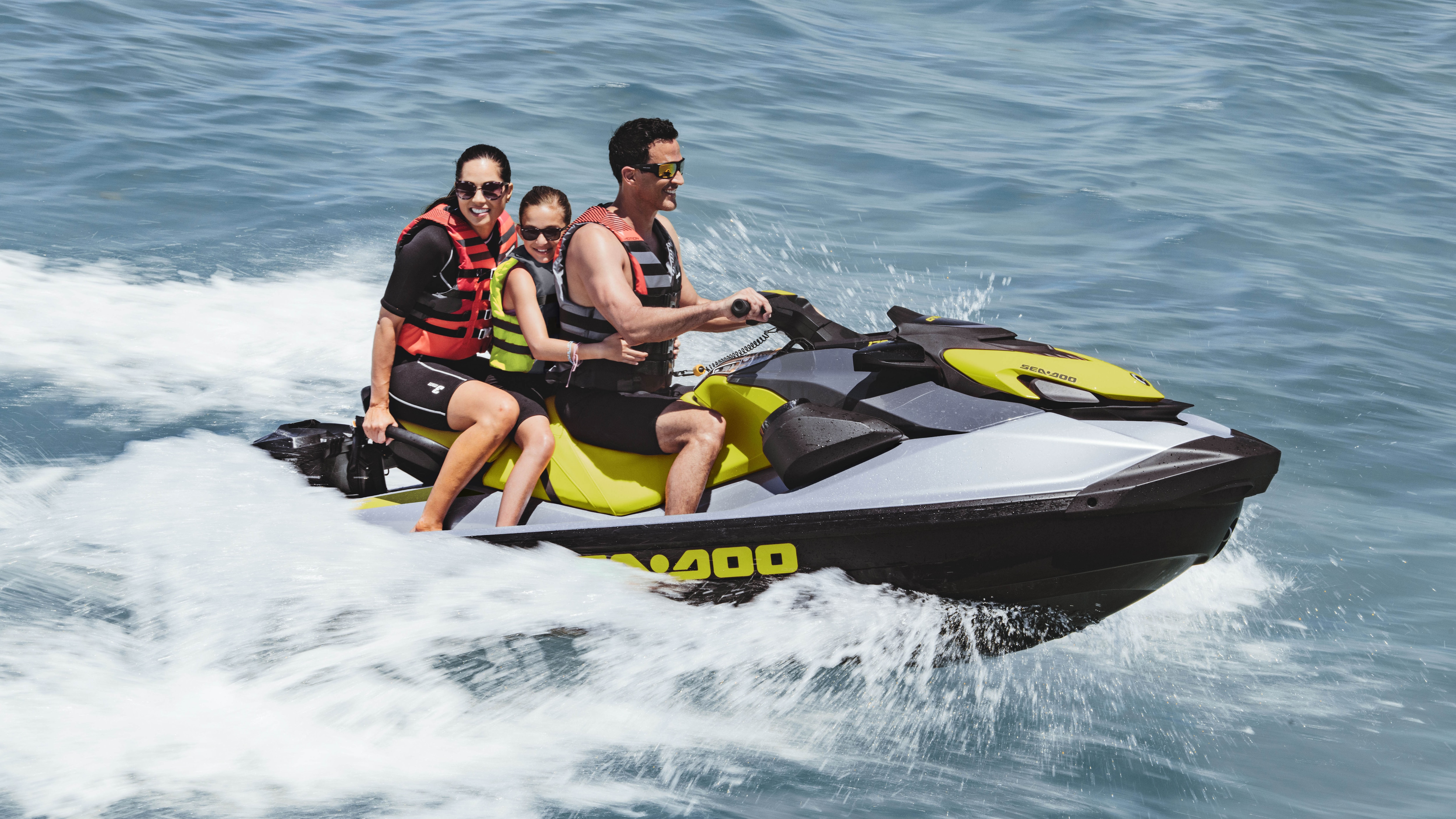 Family riding a Sea-Doo GTI SE with a Cargo box LinQ