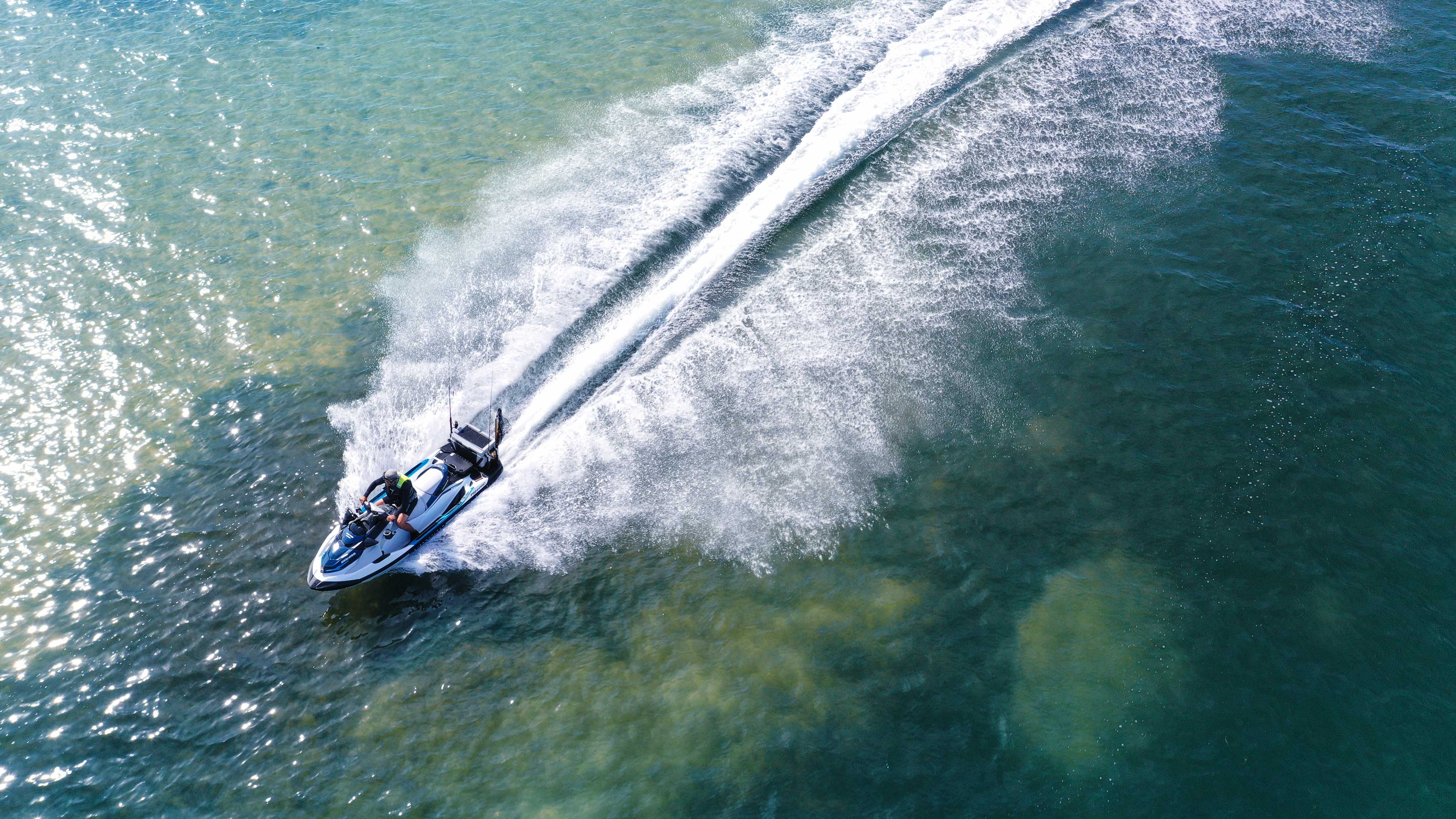 Man riding his Sea-Doo Fish Pro Sport (Drone view)